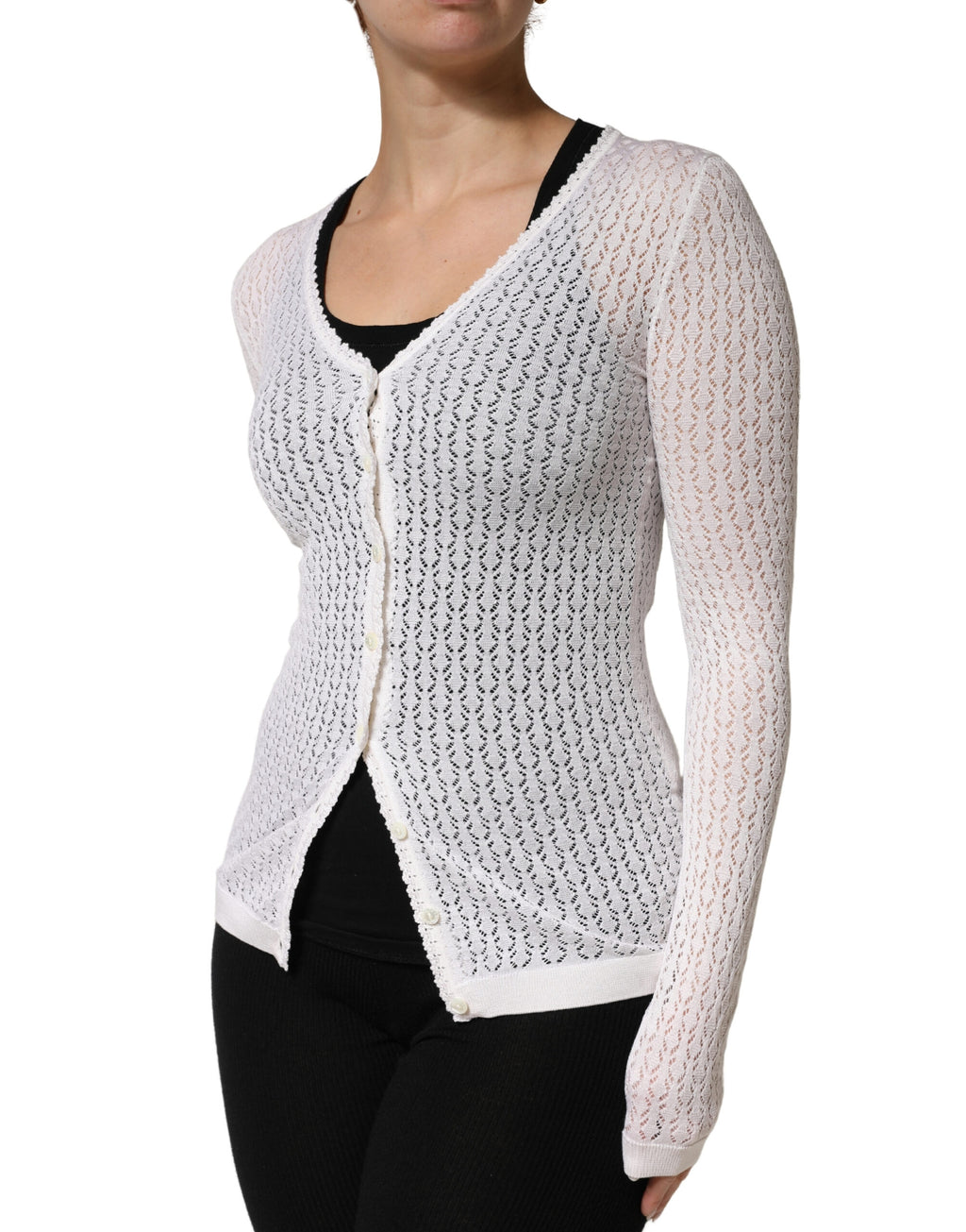 Cardigan en dentelle de soie blanche à manches longues de Dolce & Gabbana, vêtement élégant et sophistiqué.