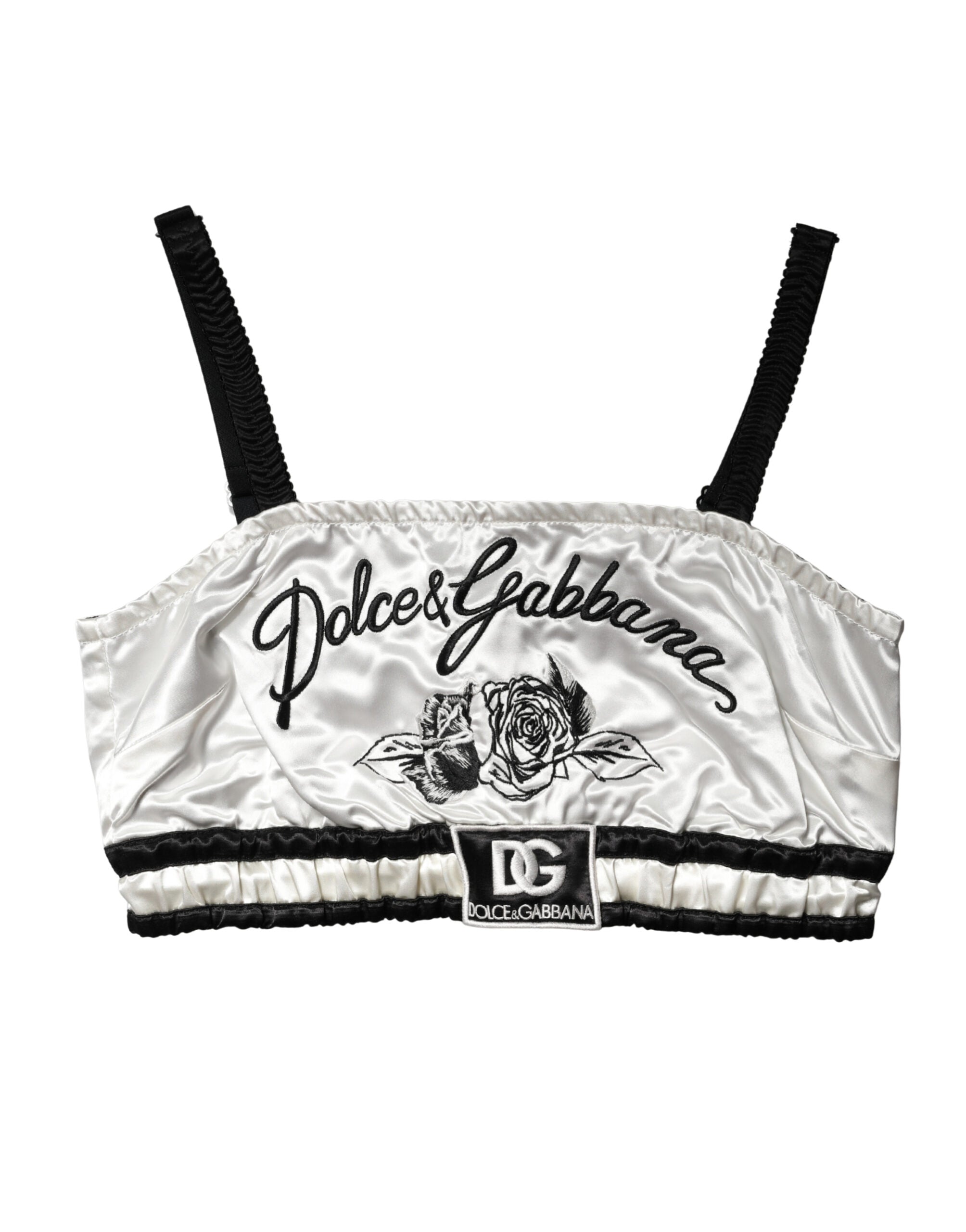 Brassière crop en satin de soie blanche Dolce & Gabbana avec logo noir, visible en détail sur la photo.