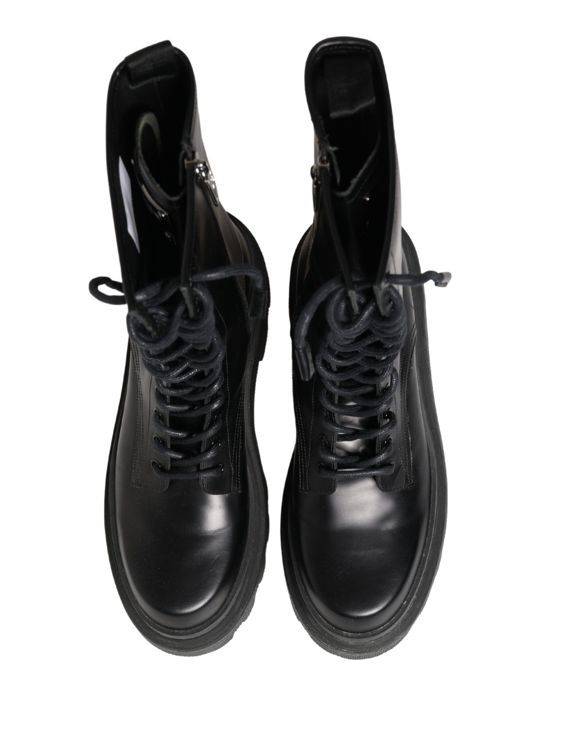 Bottes de combat en cuir noir Dolce & Gabbana avec semelle robuste, style tendance et détails élégants.