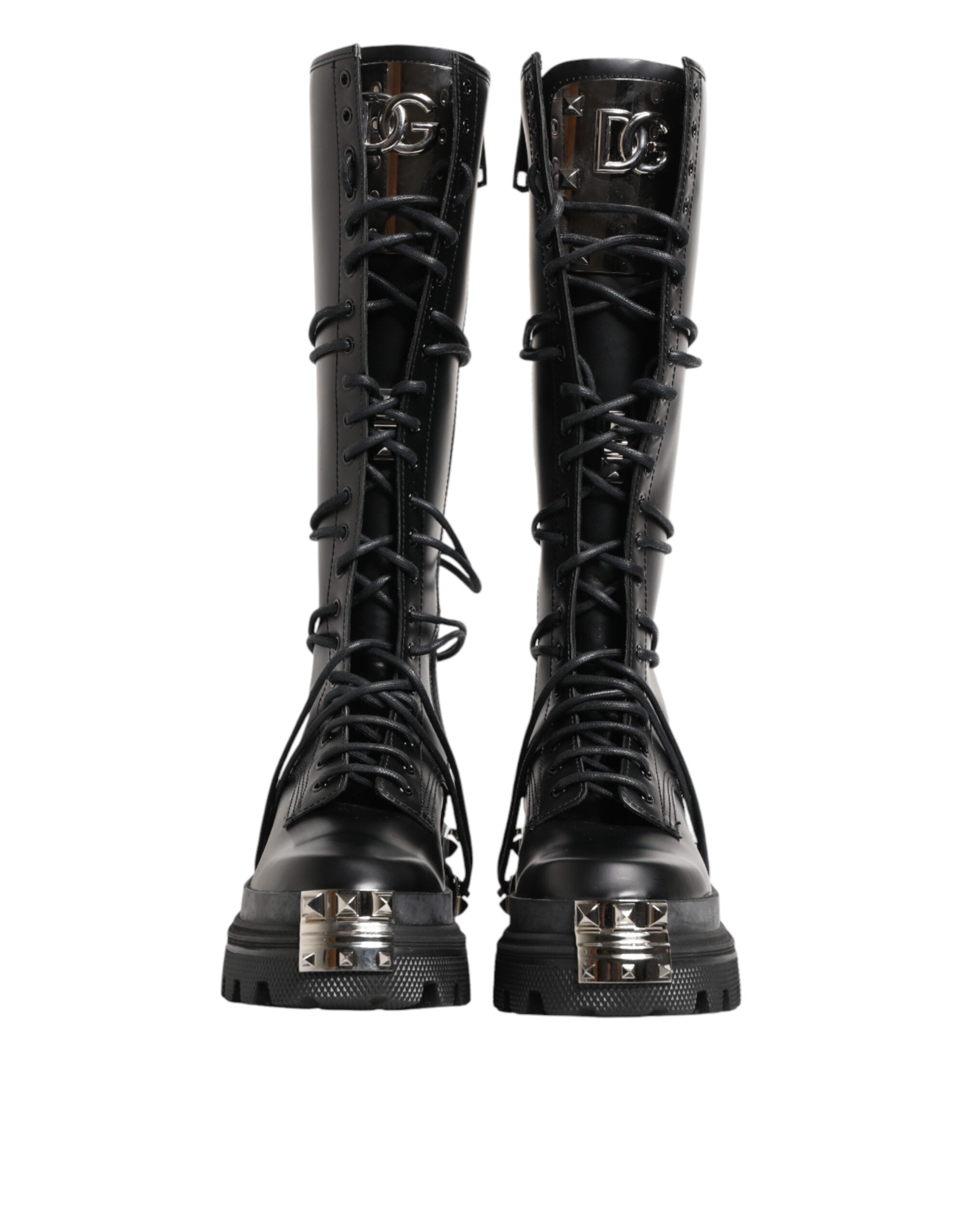 Bottes combat en cuir noir Dolce & Gabbana, hautes jusqu'au genou, avec semelle robuste et style élégant.