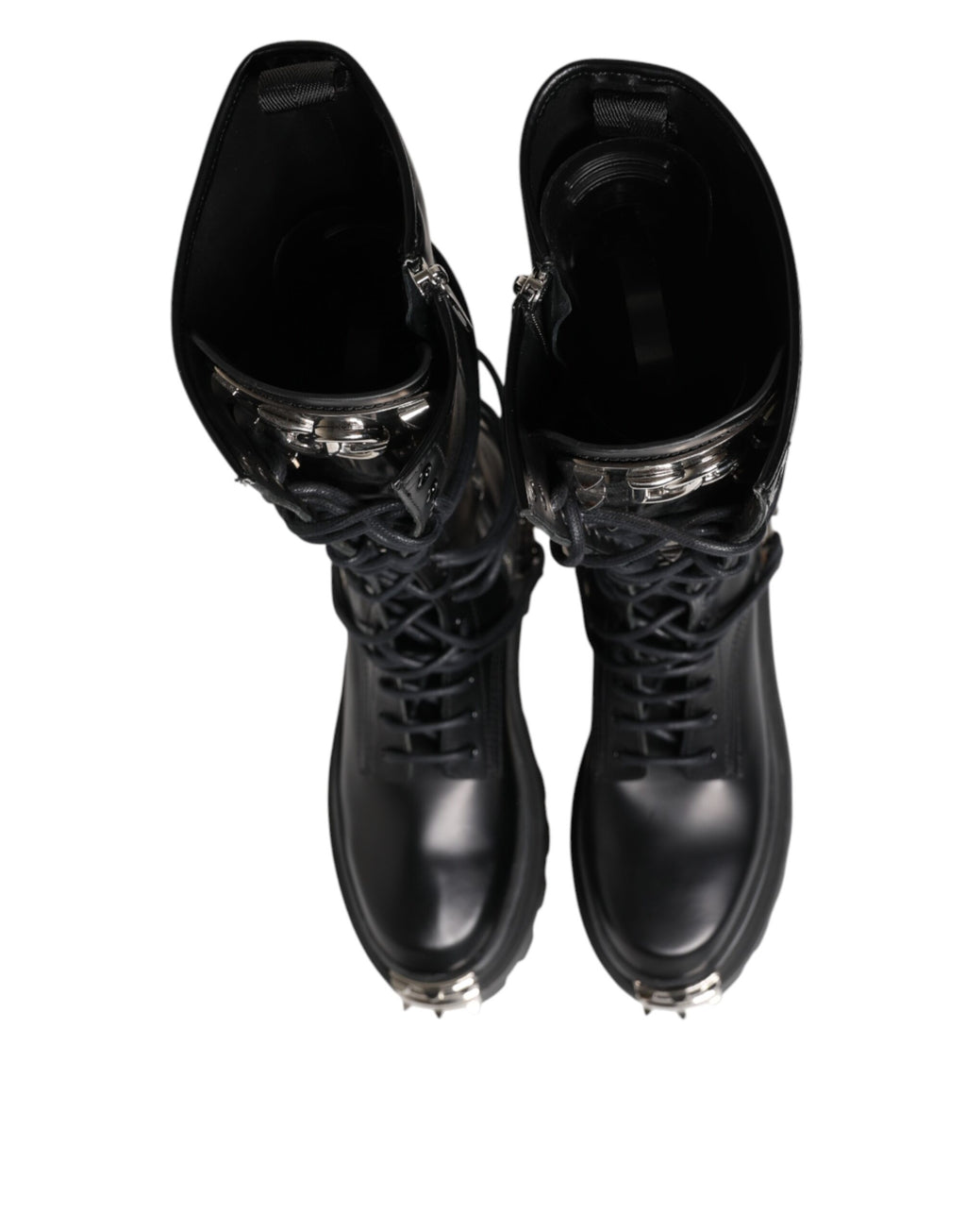 Bottes combat en cuir noir de la marque Dolce & Gabbana, hauteur genou, chaussures élégantes et robustes.