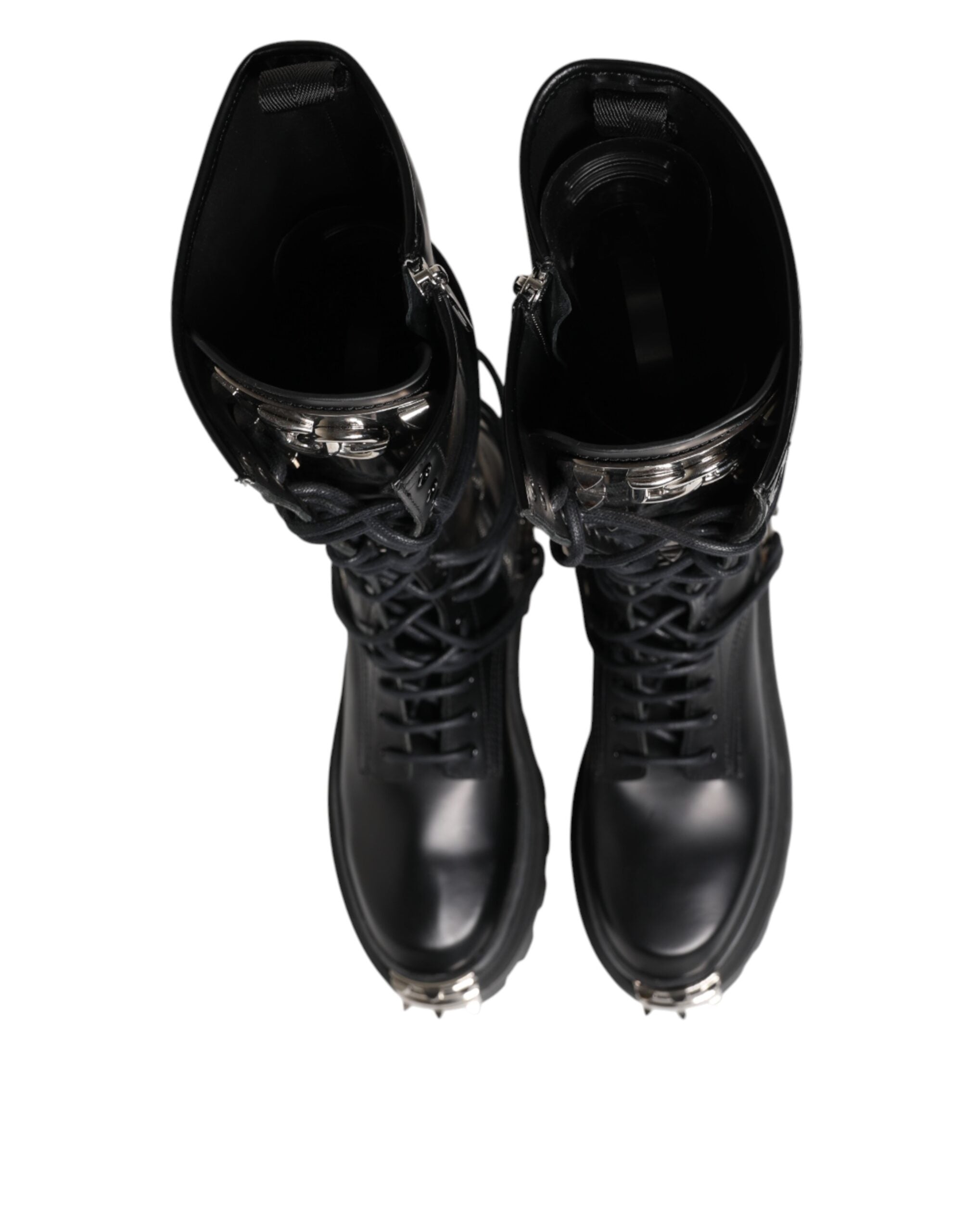 Bottes combat en cuir noir de la marque Dolce & Gabbana, hauteur genou, chaussures élégantes et robustes.