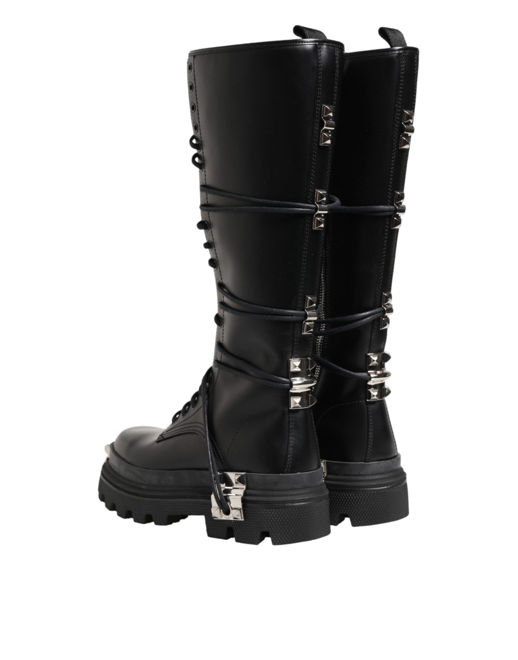 Bottes combat en cuir noir de hauteur genou de la marque Dolce & Gabbana, visibles avec détails en cuir et semelle robuste.