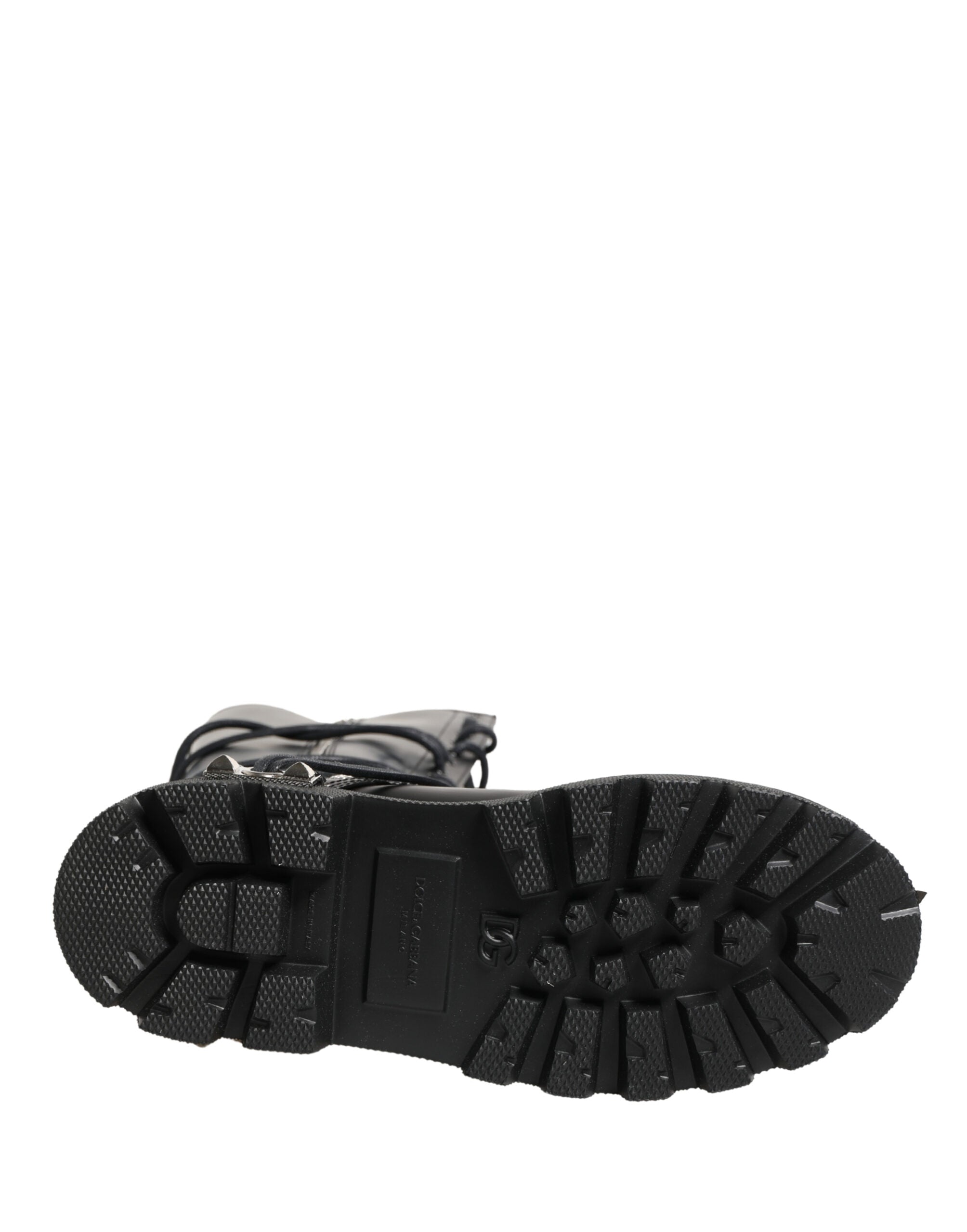 Bottes combat en cuir noir Dolce & Gabbana, mi-mollet, avec semelle robuste et détails élégants.