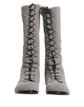 Bottes hautes en shearling gris de Dolce & Gabbana avec lacets, style élégant et confortable.