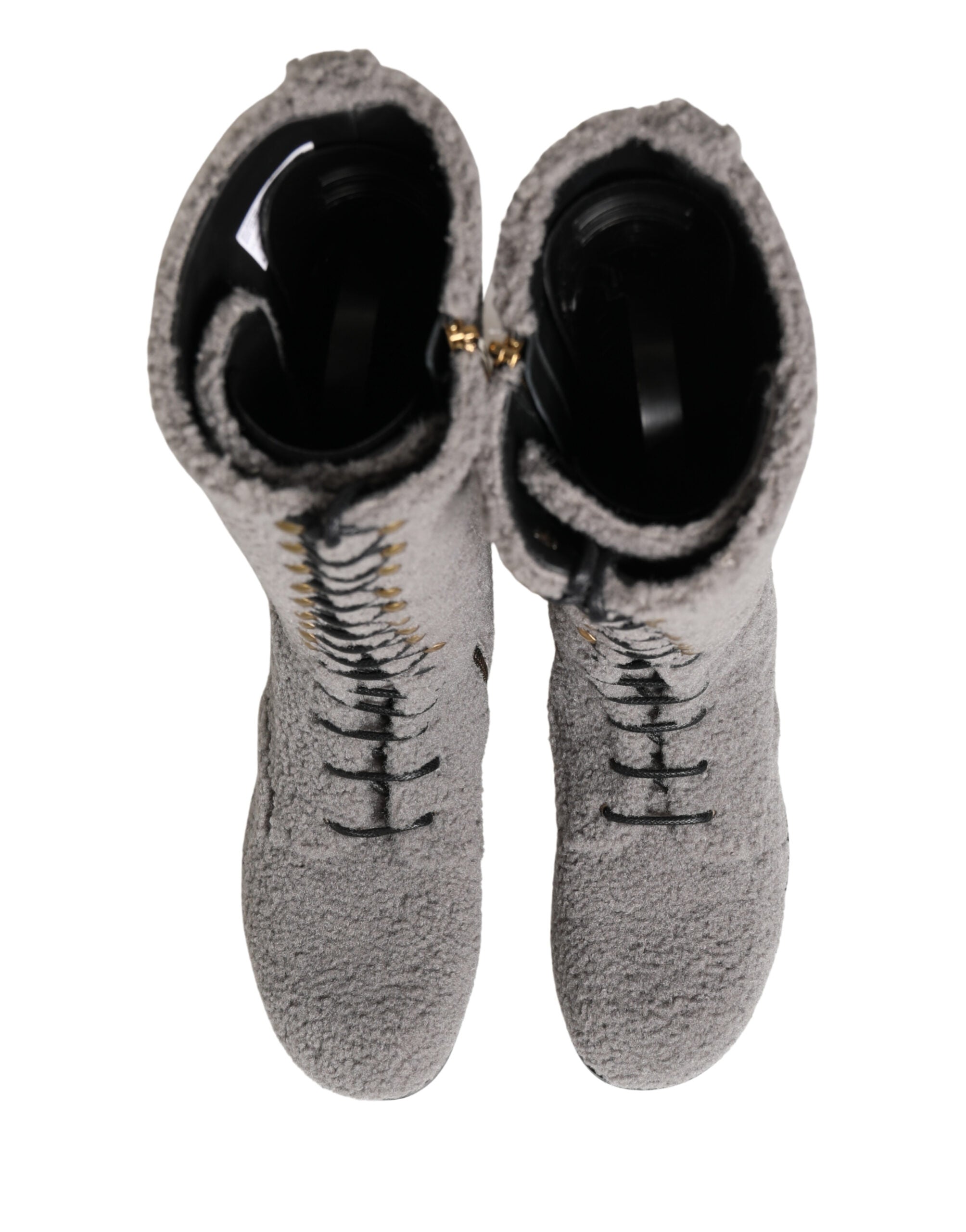 Bottes hautes en shearling gris de Dolce & Gabbana avec lacets, style élégant et confortable, pour femmes.