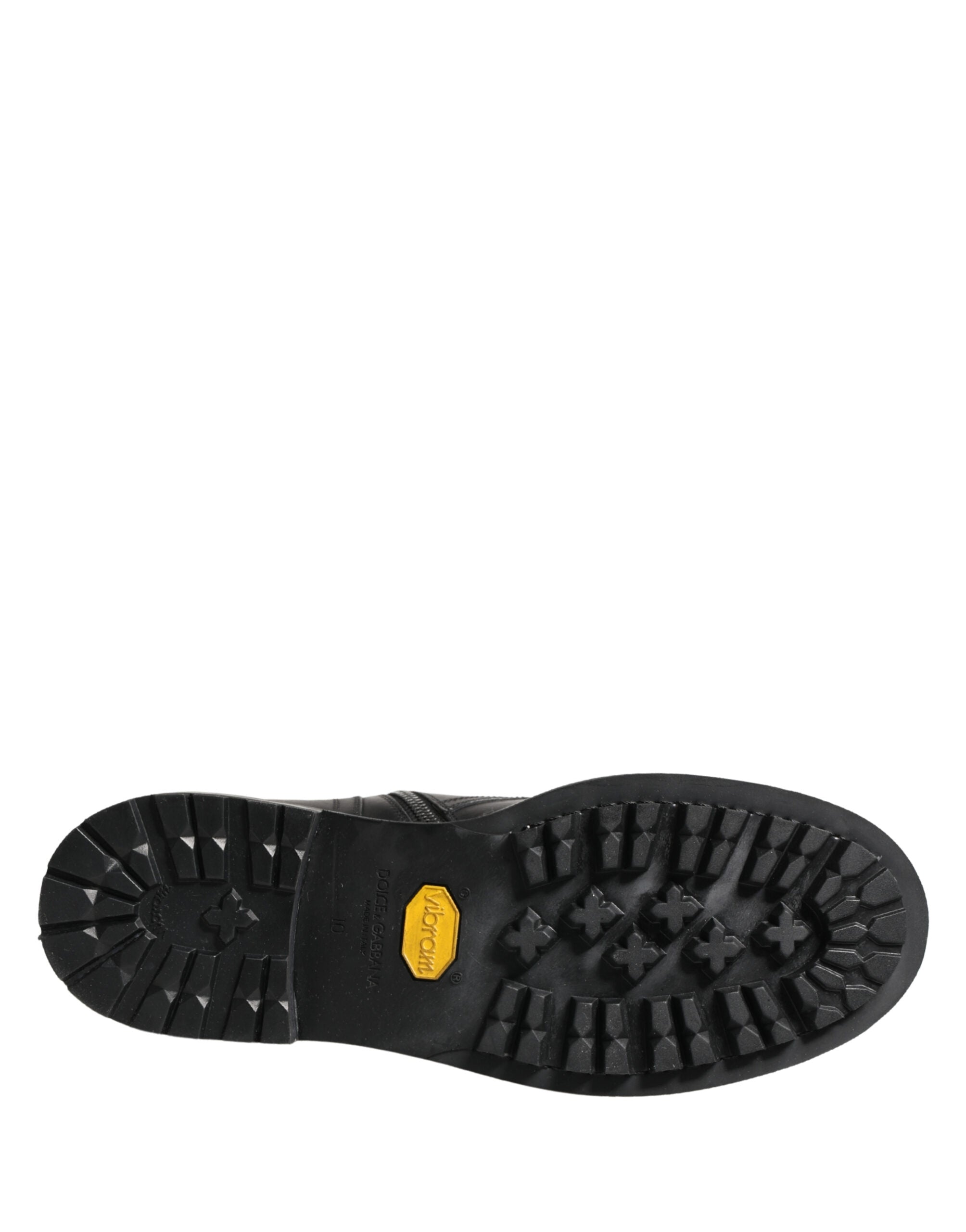 Bottes combat en cuir noir Dolce & Gabbana avec boucle, style robuste et tendance, visibles en gros plan.