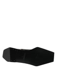 Bottes ankle en cuir noir Dolce & Gabbana avec fermeture éclair, style élégant et moderne.