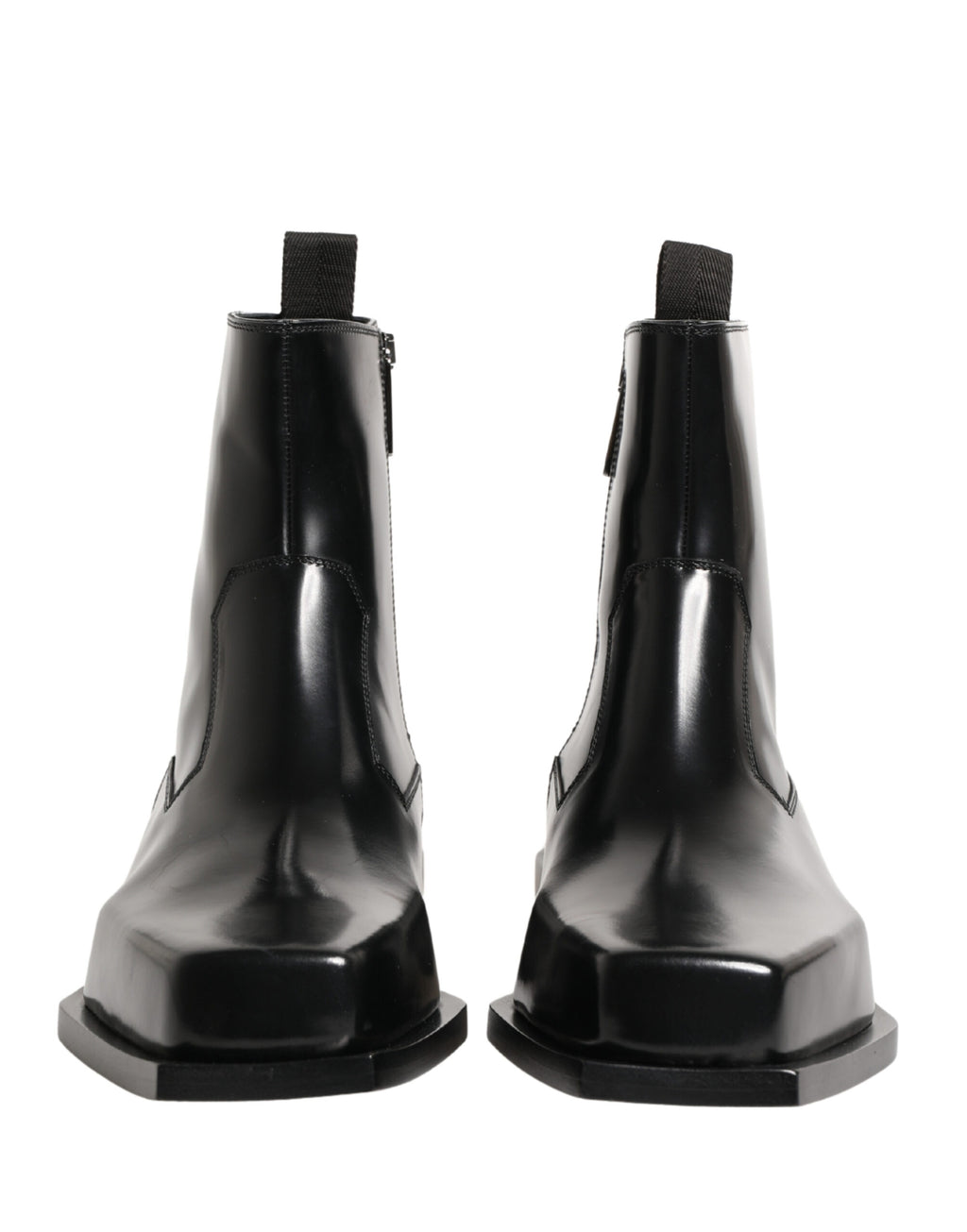 Bottines en cuir noir Dolce & Gabbana avec fermeture éclair et semelle en talon, style élégant et moderne.