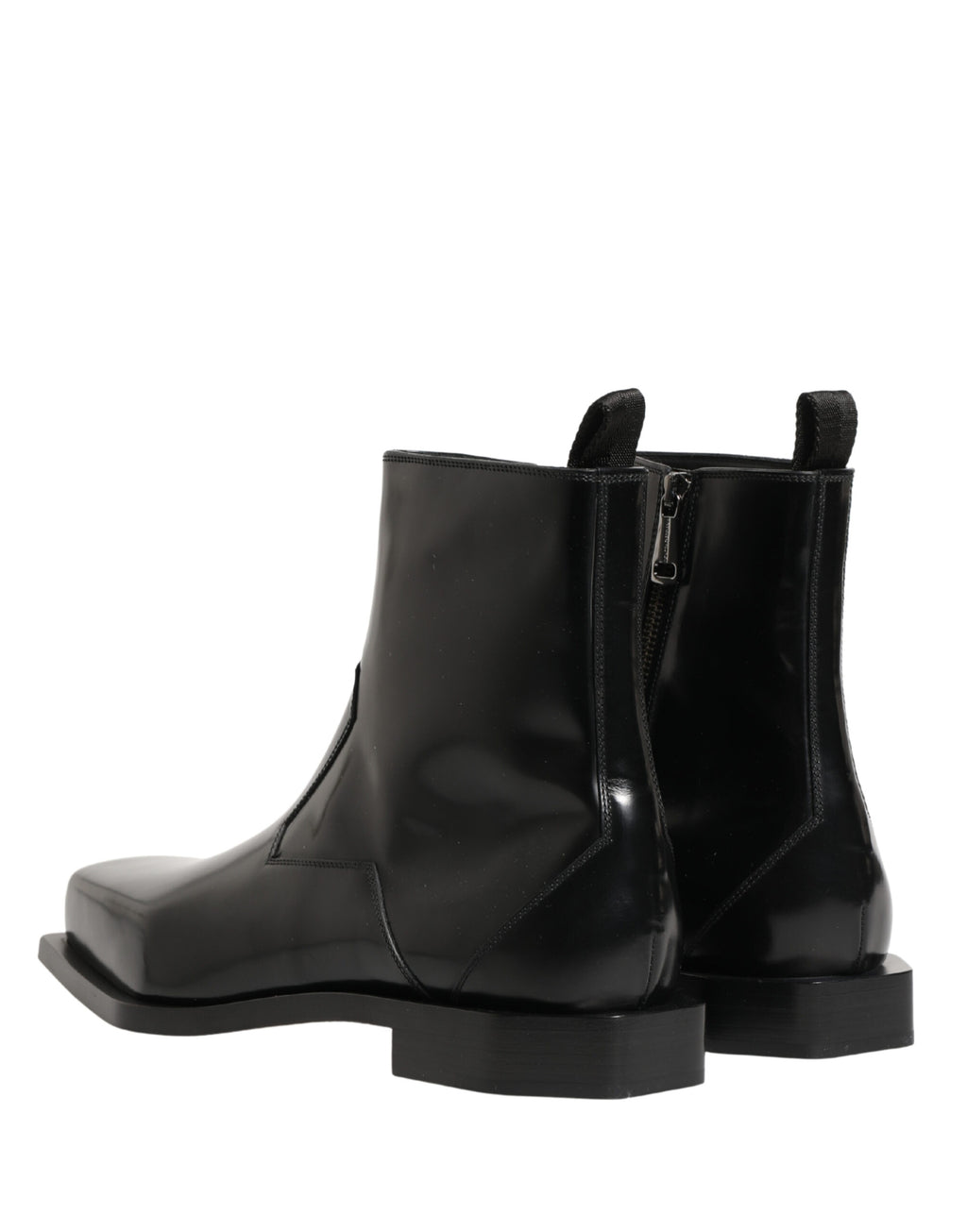 Bottines en cuir noir Dolce & Gabbana avec fermeture éclair à la cheville, talon moyen et design élégant.
