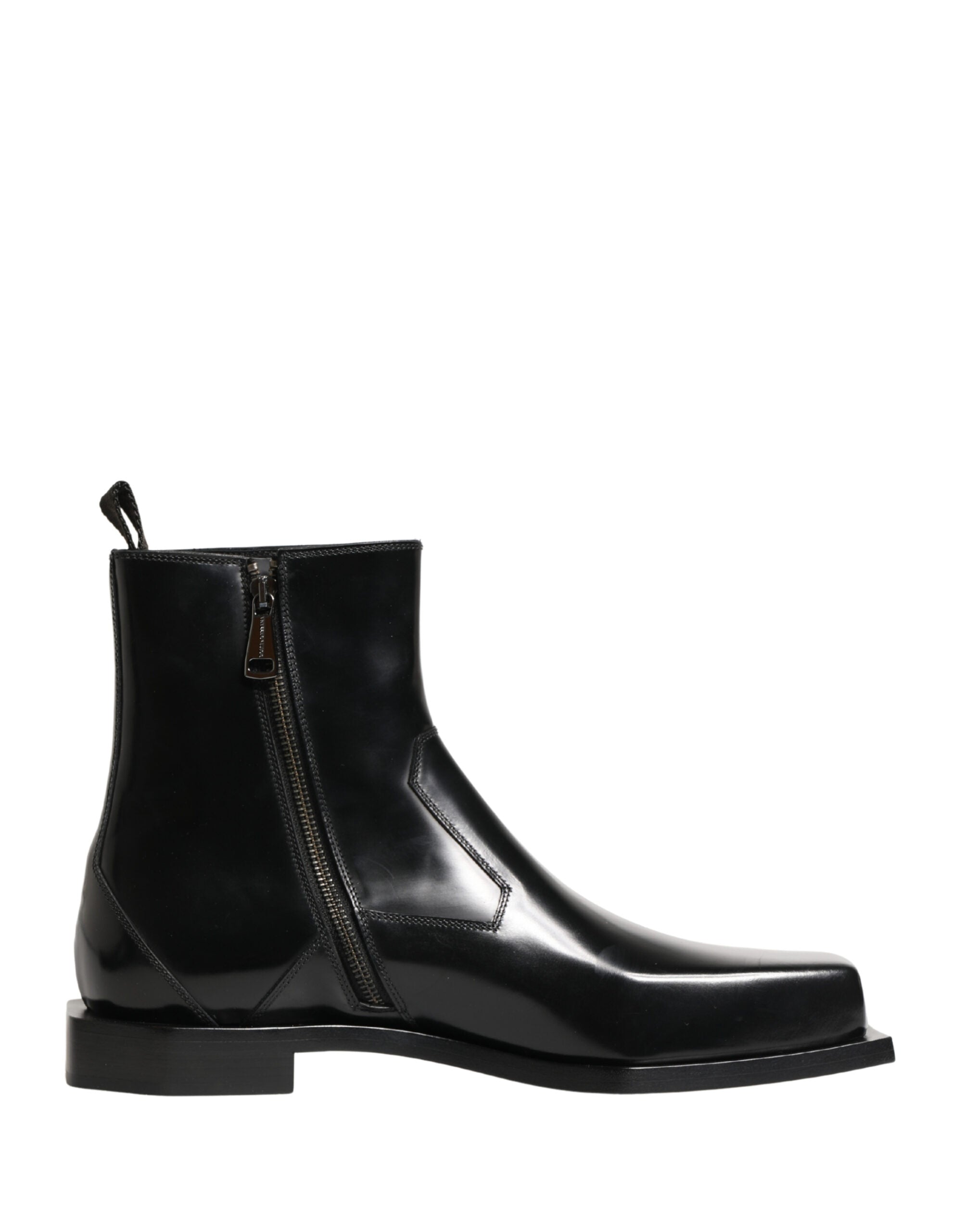 Bottines à talons en cuir noir Dolce & Gabbana avec fermeture éclair et semelle en cuir, élégantes et modernes.