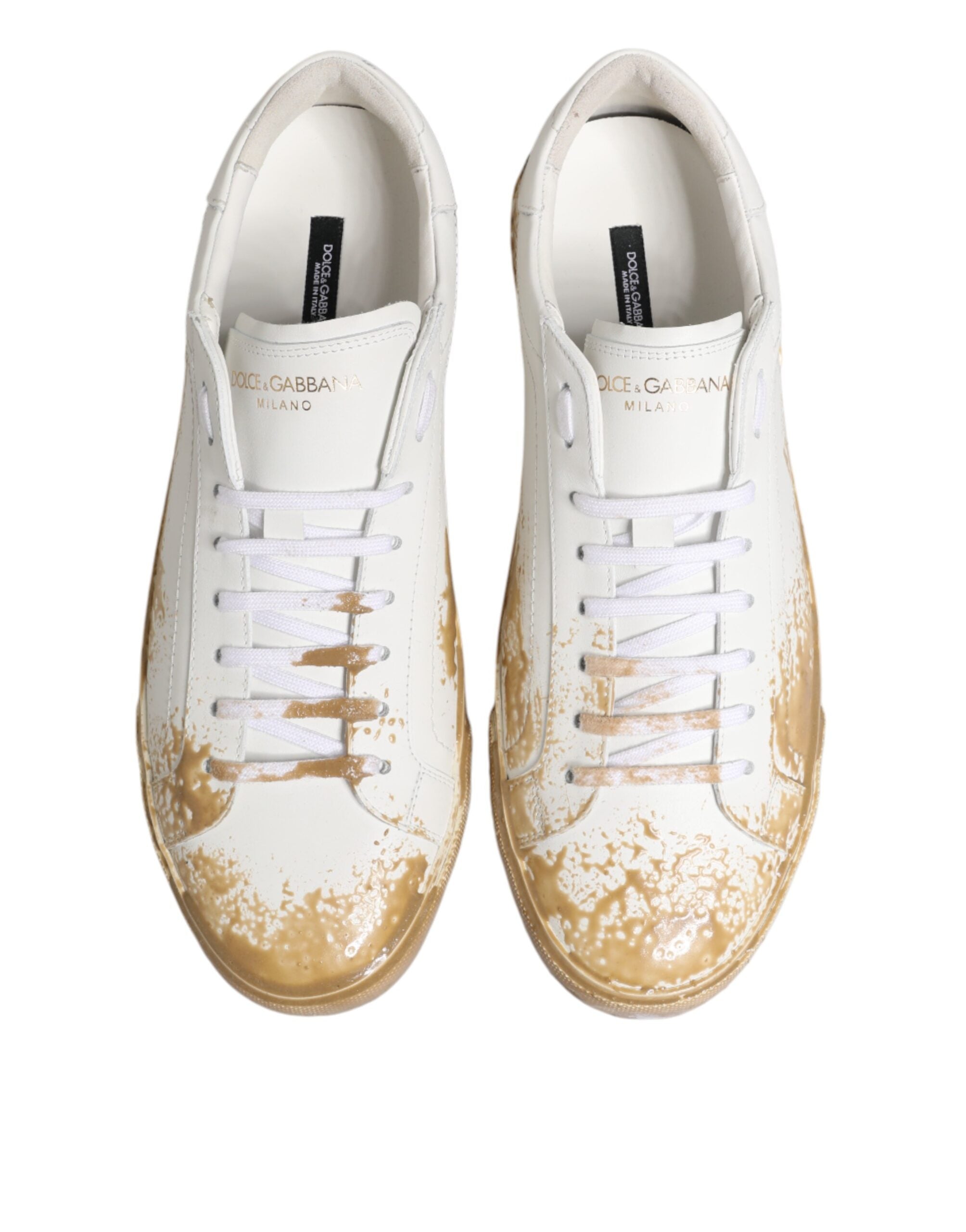 Baskettes basses en cuir blanc Dolce & Gabbana avec effet peinture, chaussures élégantes pour un style sophistiqué.
