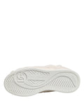 Chaussures sneakers basses blanches en fourrure de shearling Dolce & Gabbana, style élégant et confortable.