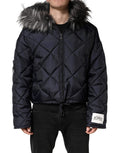 Veste en fourrure matelassée noire avec capuche en shearling, de la marque Dolce & Gabbana, pour un look élégant et chaud.