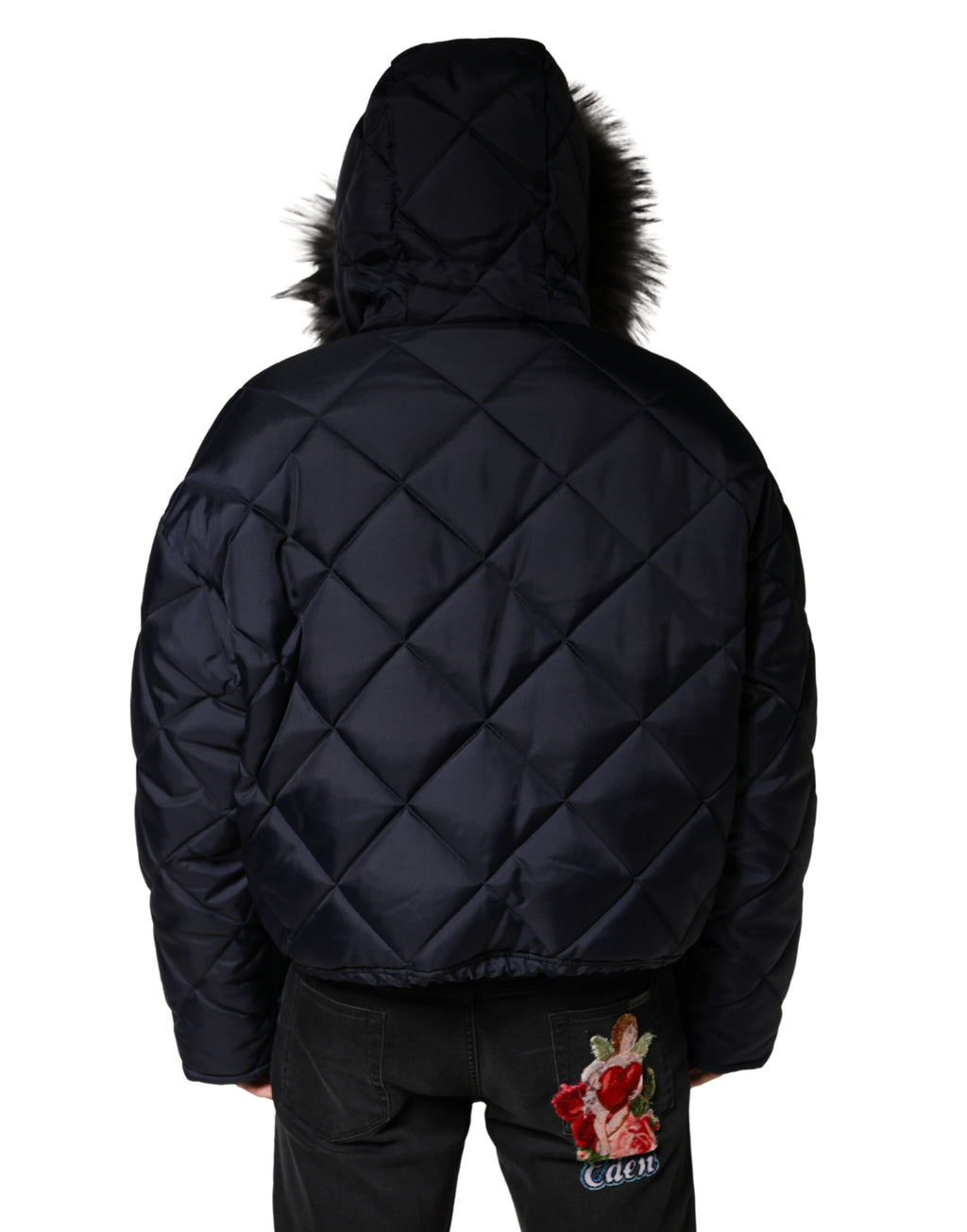 Veste en fourrure matelassée noire avec capuche en shearling, marque Dolce & Gabbana, style élégant et chaud.