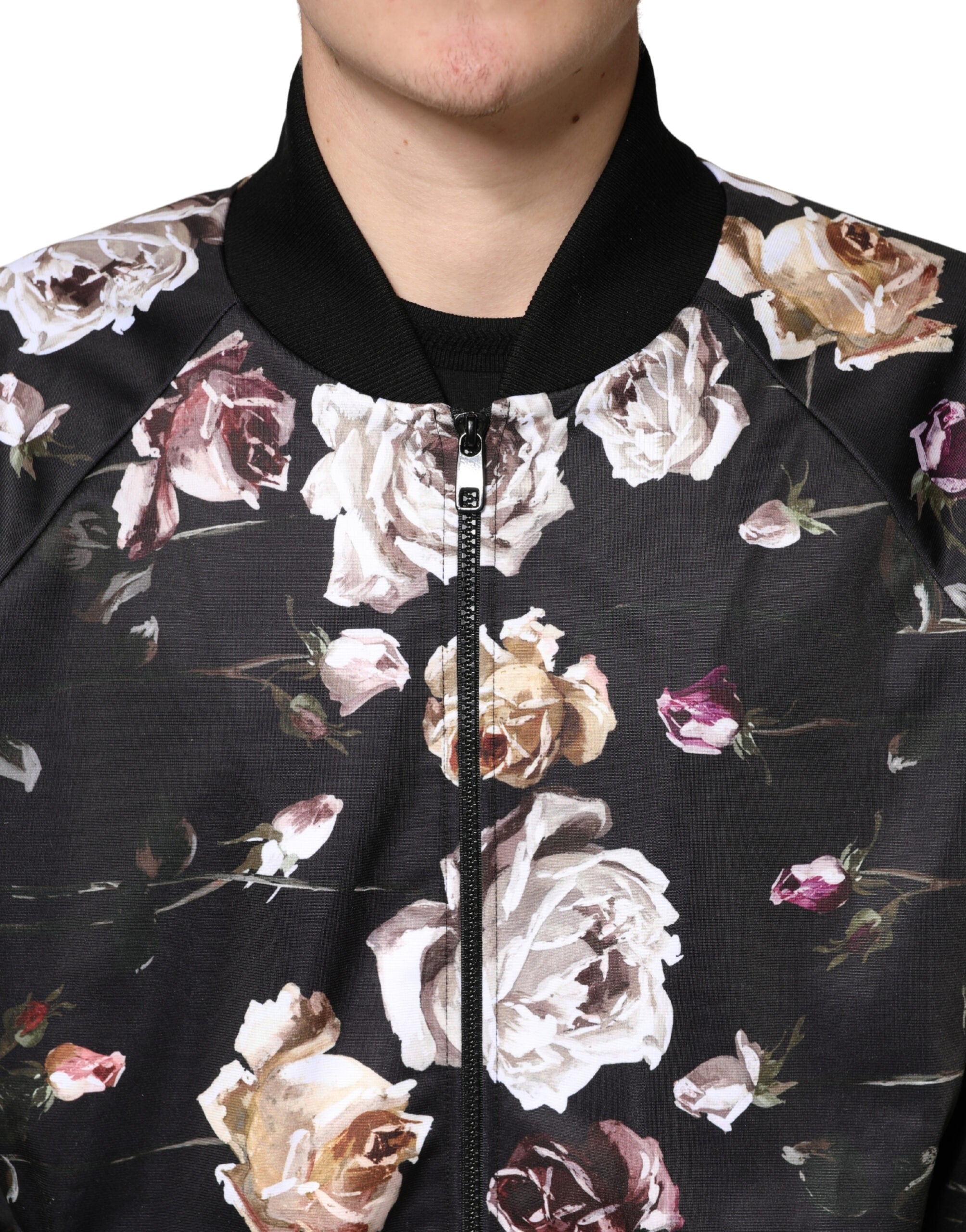 Veste bomber noire en polyester avec motifs floraux Dolce & Gabbana, fermeture éclair complète, style élégant et moderne.