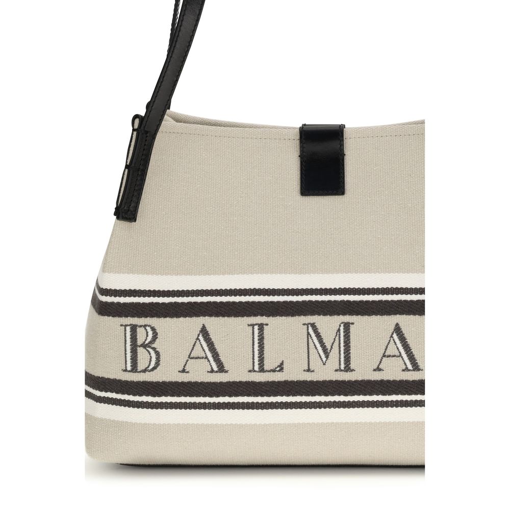 Sac à épaules Balmain en coton beige, élégant et tendance, avec détails sophistiqués visibles sur l'image.