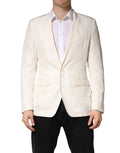 Blazer blanc en coton Dolce & Gabbana à simple boutonnage, veste élégante avec col et poches visibles.