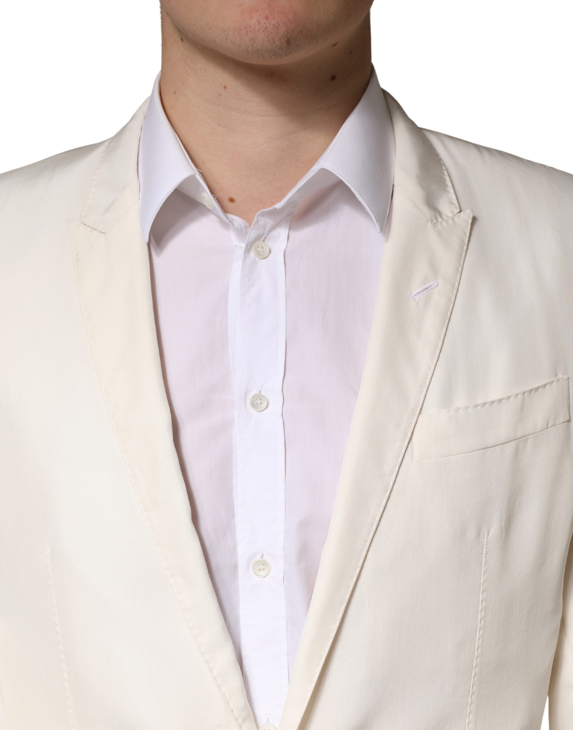 Veste blazer en coton blanc Dolce & Gabbana à un bouton, coupe classique, visible sur l’image.