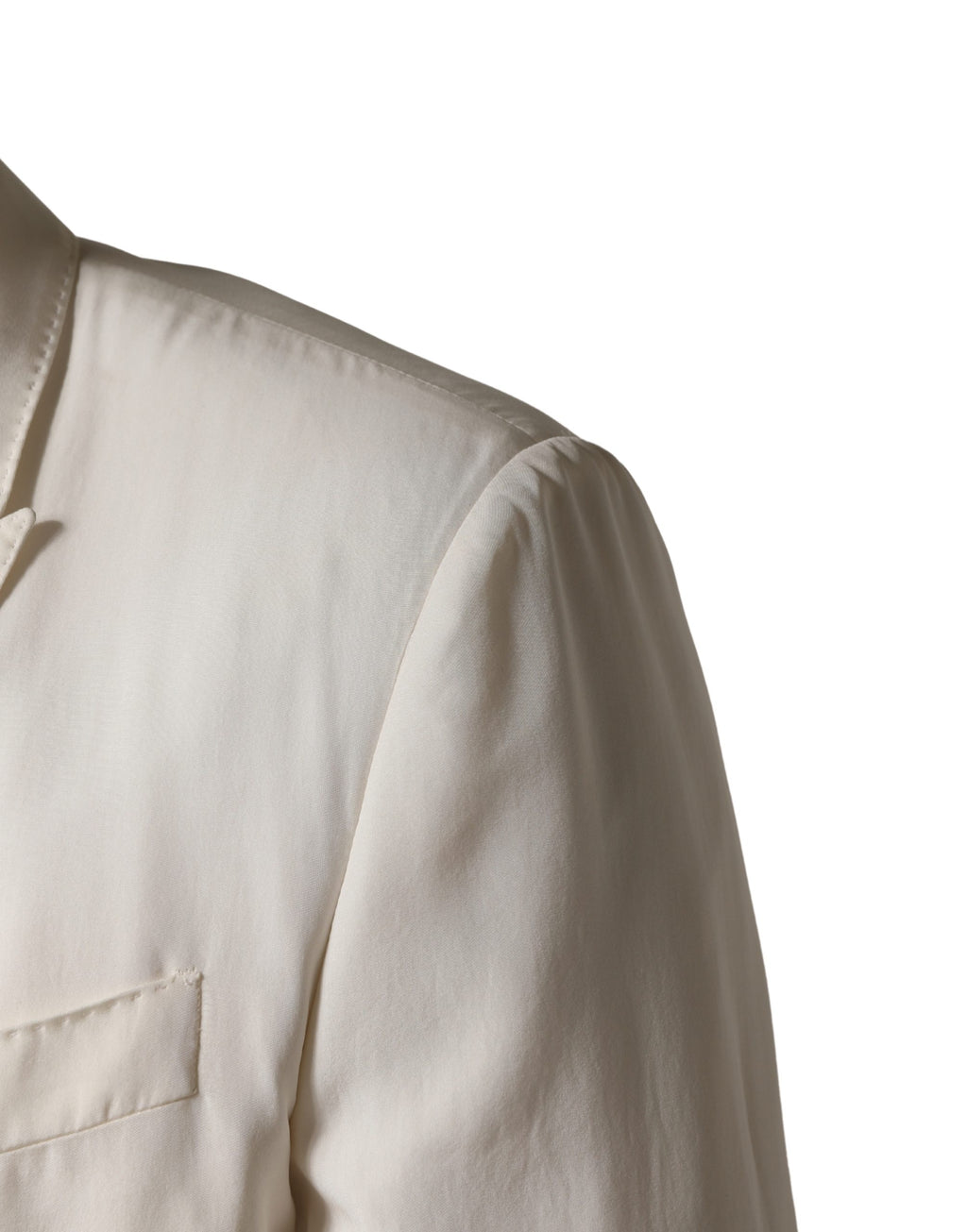 Veste blazer blanche en coton Dolce & Gabbana à un simple boutonnage, élégante et classique, visible sur l'image.