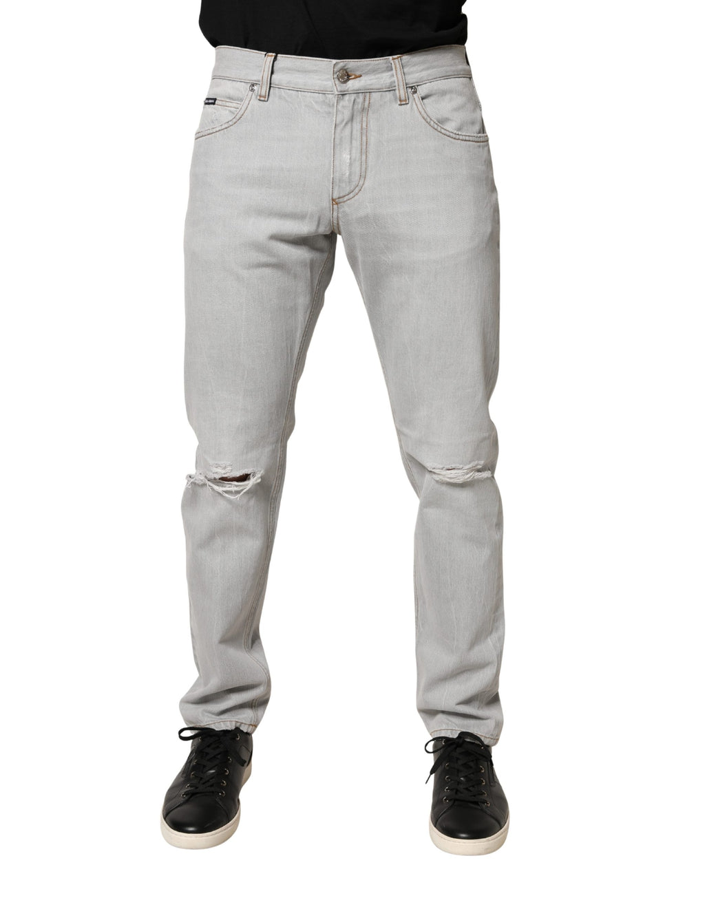 Jeans en denim coton gris clair de Dolce & Gabbana avec des déchirures et une coupe régulière, visibles sur l'image.