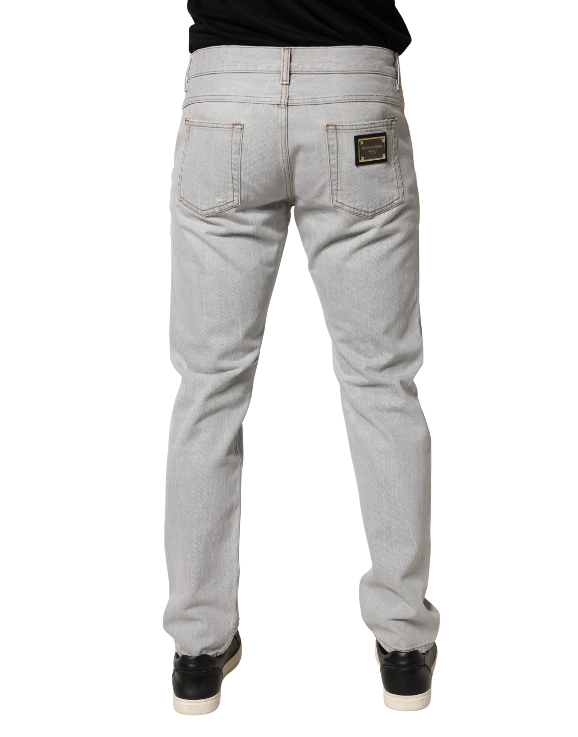 Jeans en coton gris clair déchirés de Dolce & Gabbana, coupe régulière et style décontracté.