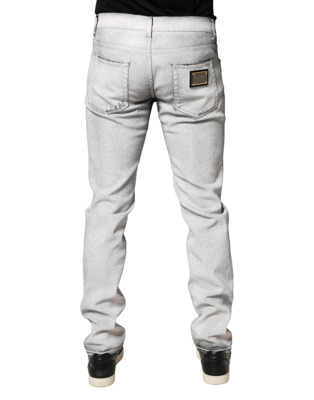 Jeans homme skinny gris clair Dolce & Gabbana en denim déchiré, coupe ajustée et style moderne.