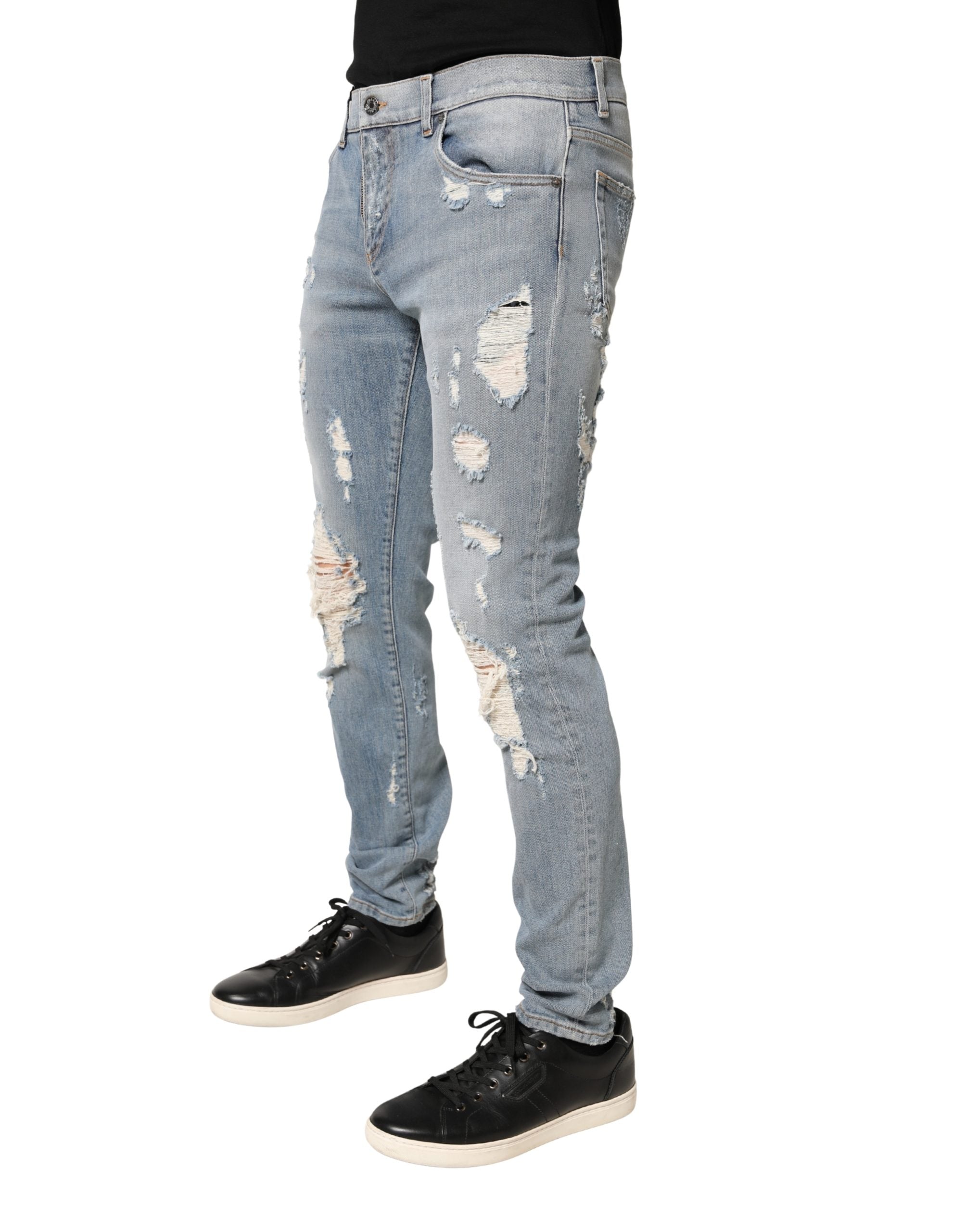 Jeans skinny déchirés bleu clair Dolce & Gabbana Light Blue pour homme, denim ajusté avec détails usés.
