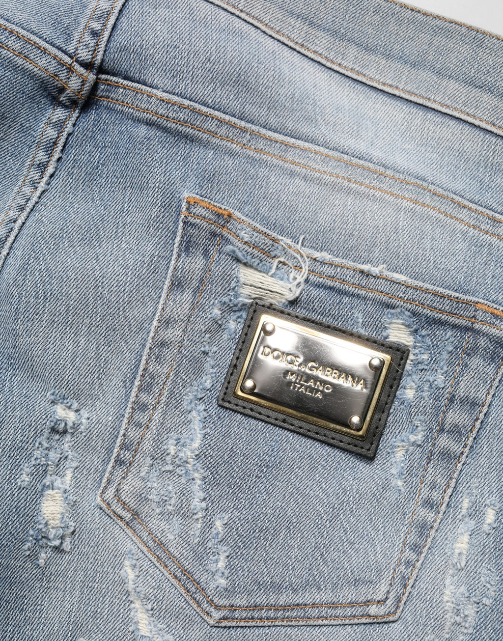 Jeans skinny déchirés pour homme Dolce & Gabbana Light Blue, denim bleu clair avec détails usés et style moderne.
