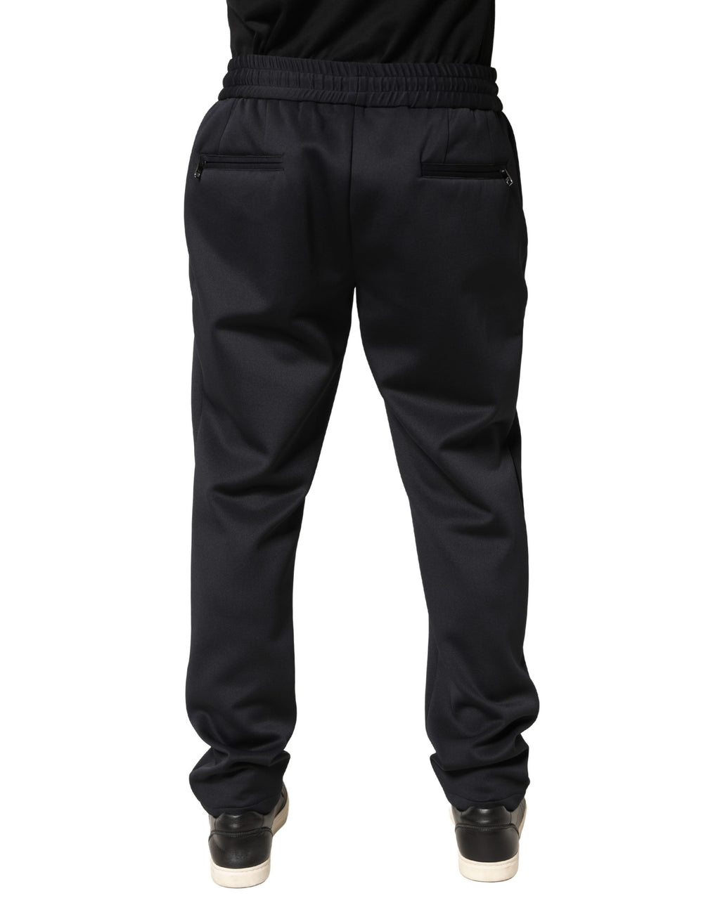 Pantalons joggers skinny en polyester noir de Dolce & Gabbana, style décontracté et ajusté, visibles dans l'image.