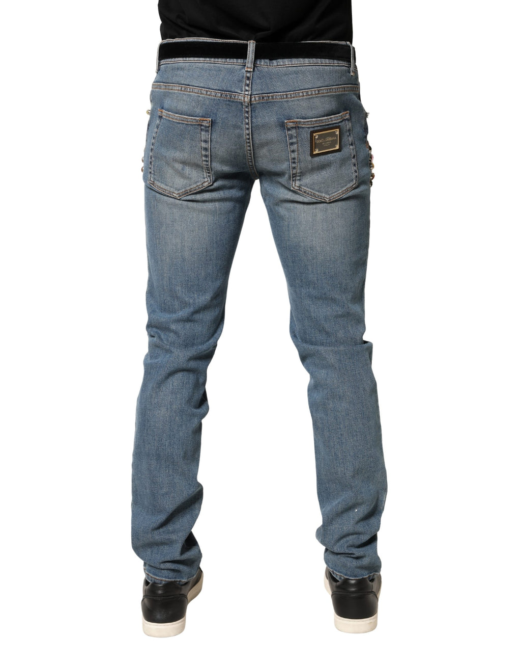 Jeans en denim bleu pour homme de Dolce & Gabbana avec embellissements, coupe ample en coton.