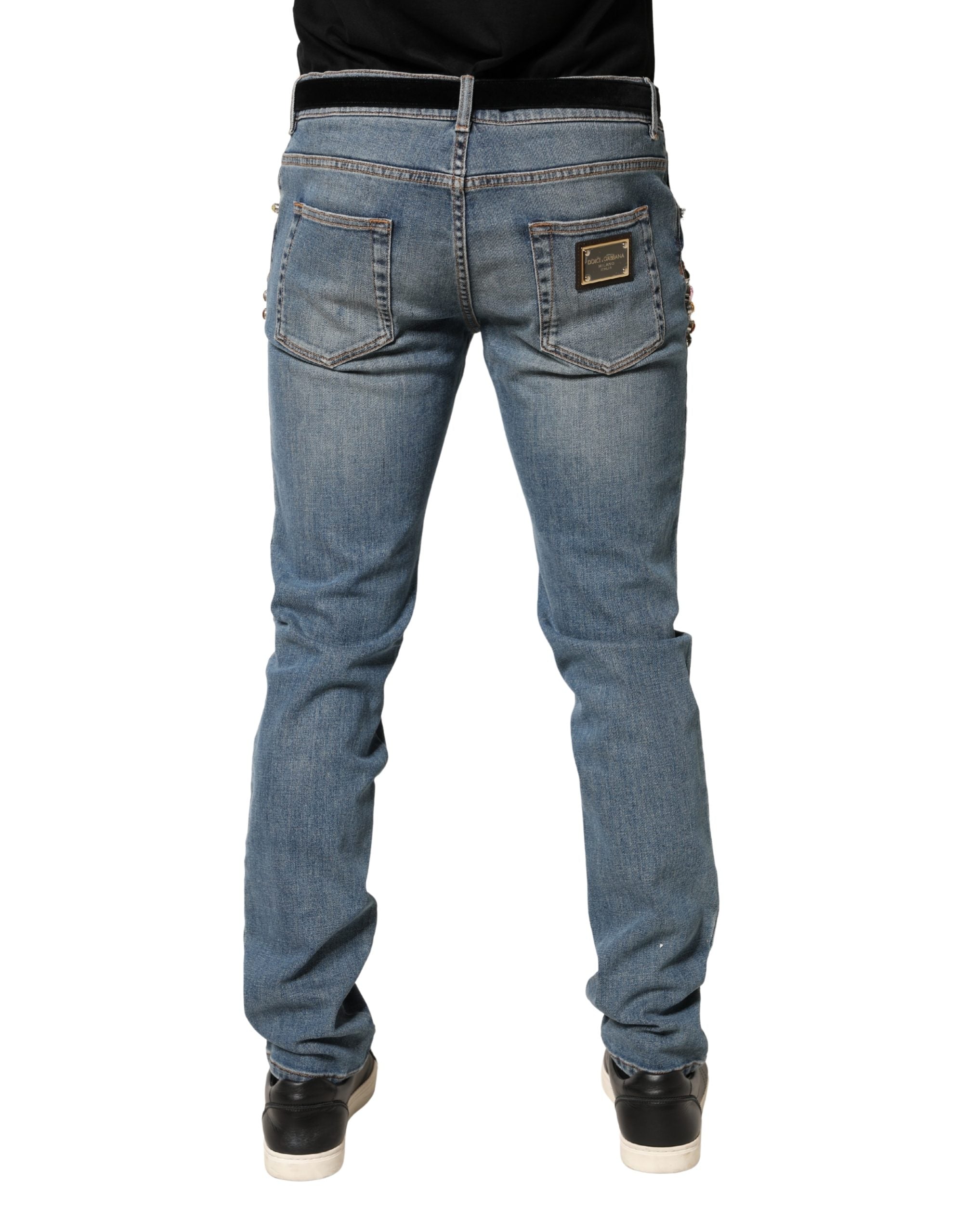 Jeans en denim bleu pour homme de Dolce & Gabbana avec embellissements, coupe ample en coton.