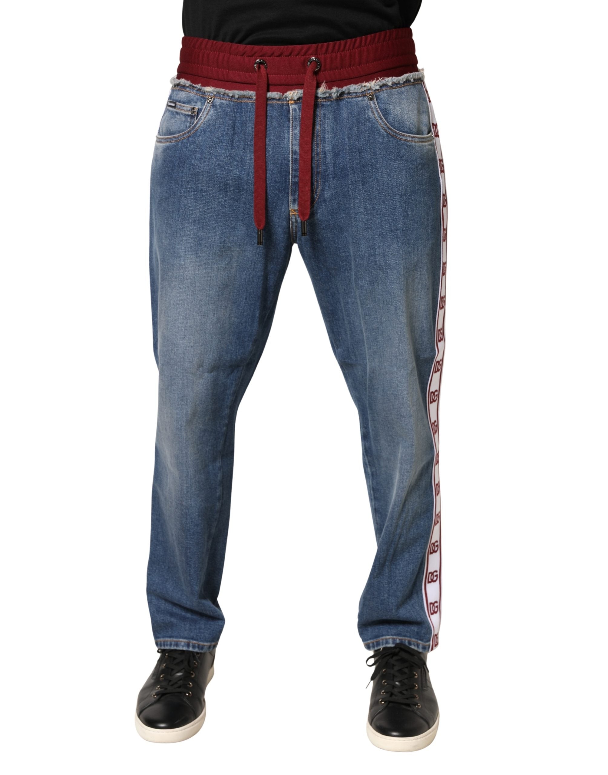Jeans droits en denim coton bleu Dolce & Gabbana avec cordon de serrage, vue frontale sur pantalon décontracté.