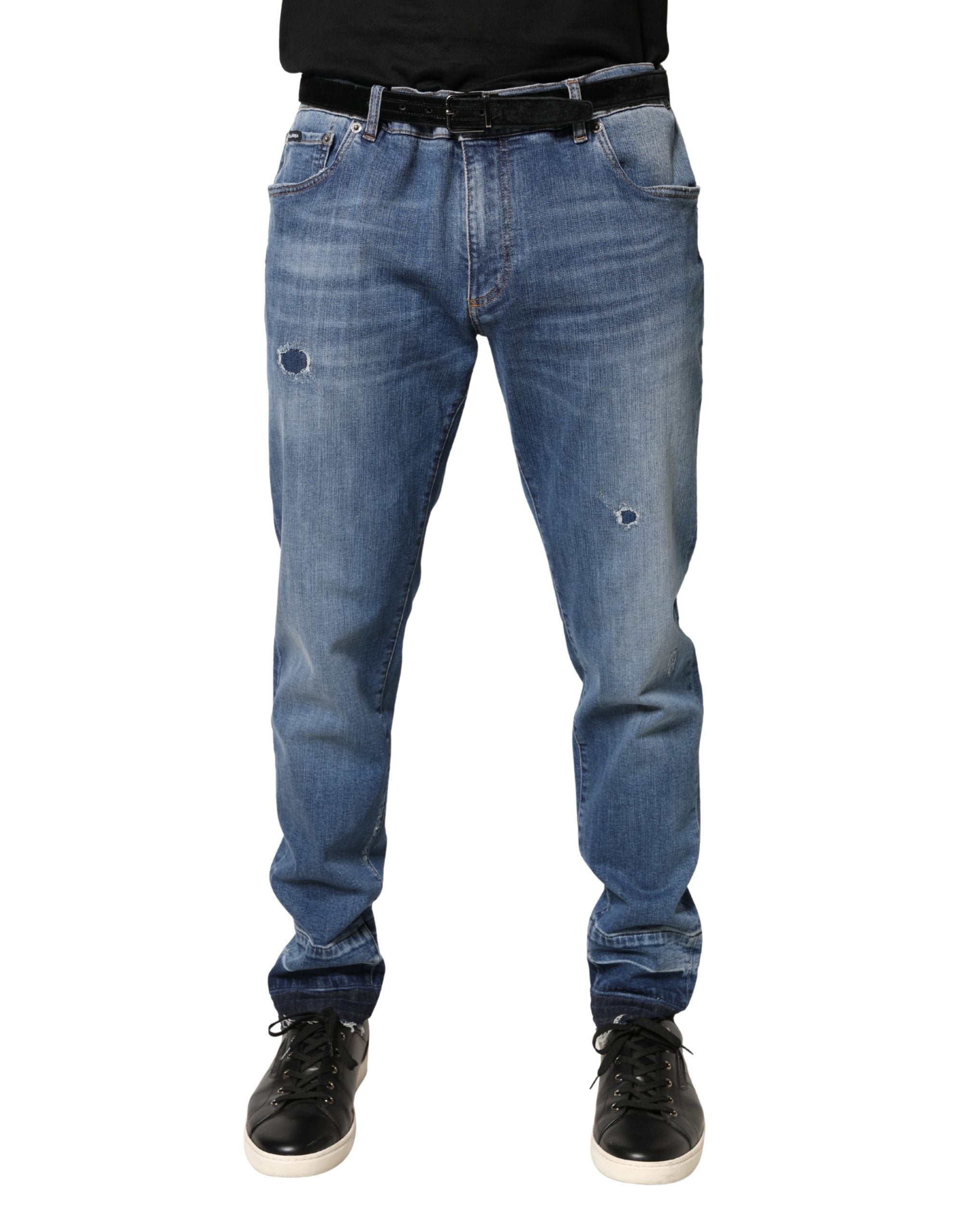 Jeans skinny en denim coton bleu déchiré de Dolce & Gabbana, style tattered, visible en détail sur le produit.