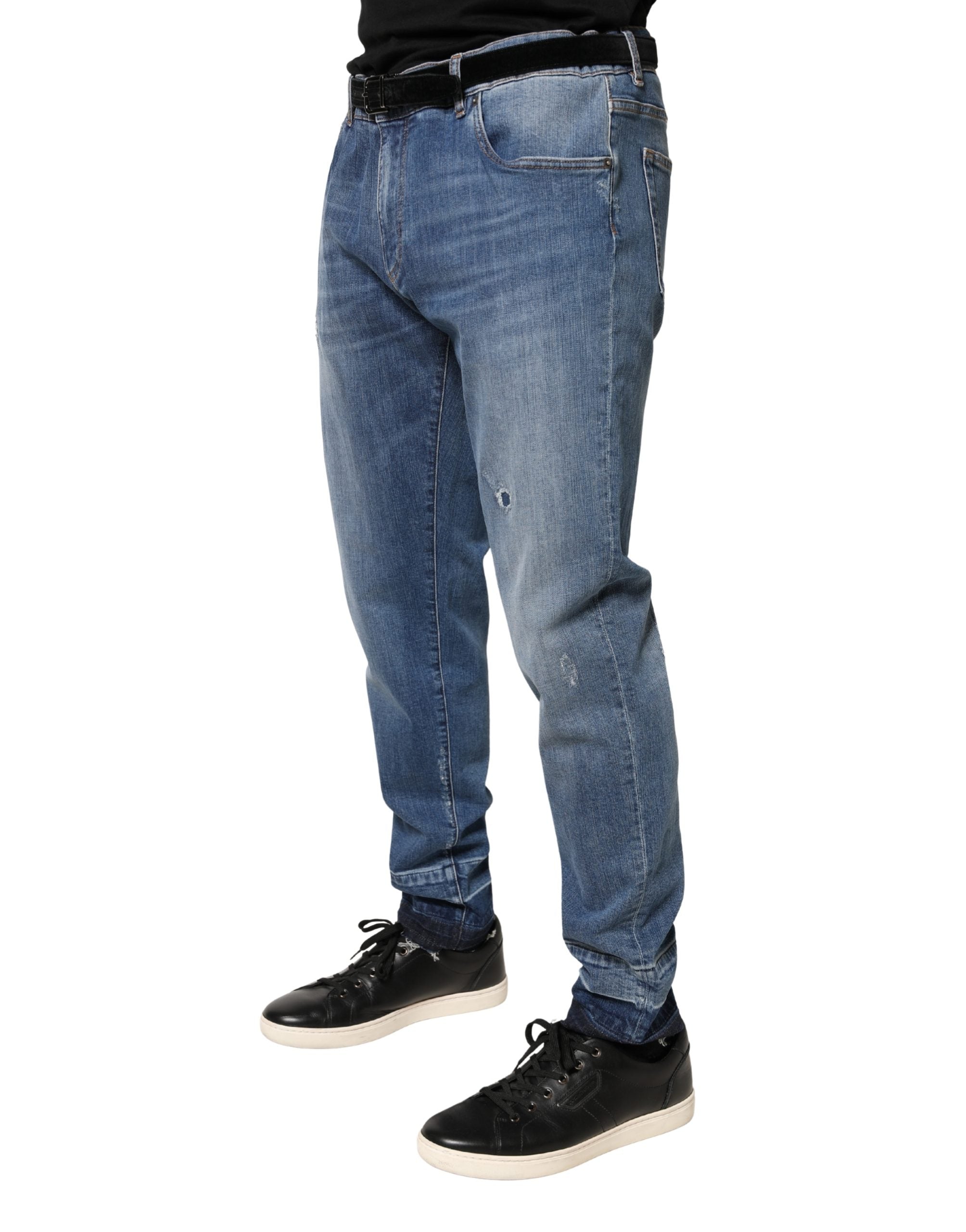 Jeans skinny en coton déchiré bleu de Dolce & Gabbana, style décontracté avec détails usés et coupe ajustée.