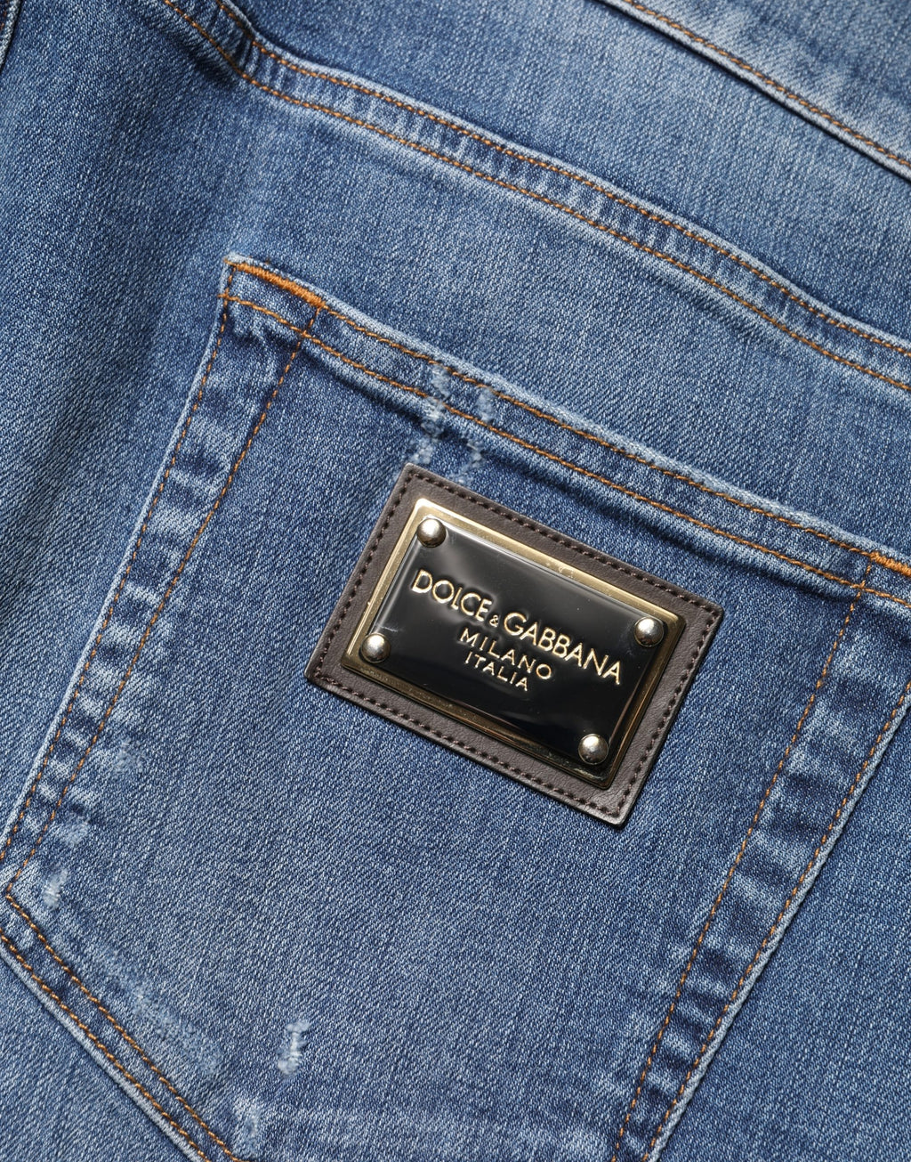 Jeans slim déchirés en coton bleu Dolce & Gabbana, coupe skinny, style décontracté avec détails usés.