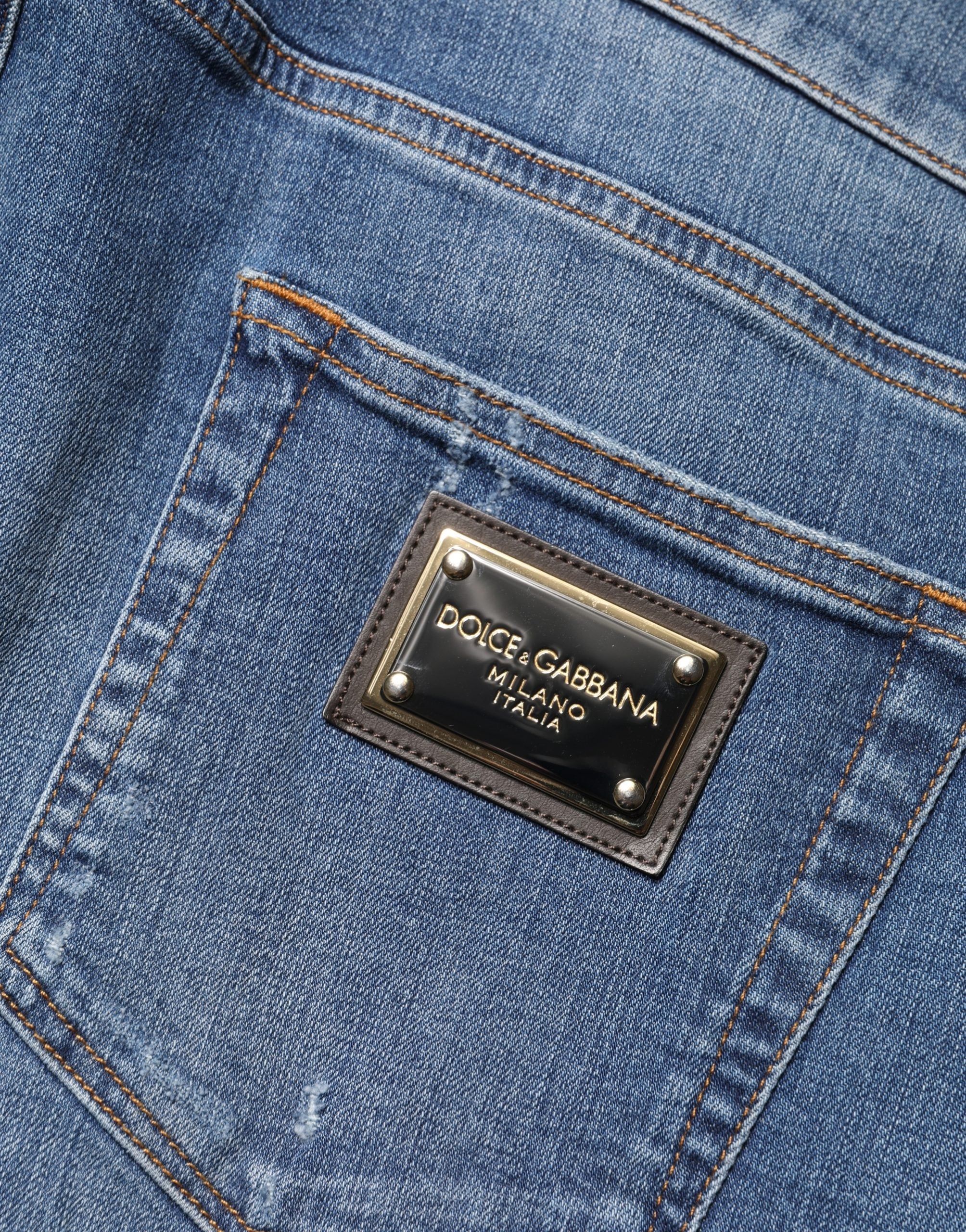 Jeans slim déchirés en coton bleu Dolce & Gabbana, coupe skinny, style décontracté avec détails usés.