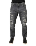 Jeans en denim gris foncé déchiré de coupe ample de Dolce & Gabbana, tissu en coton, style décontracté et tendance.