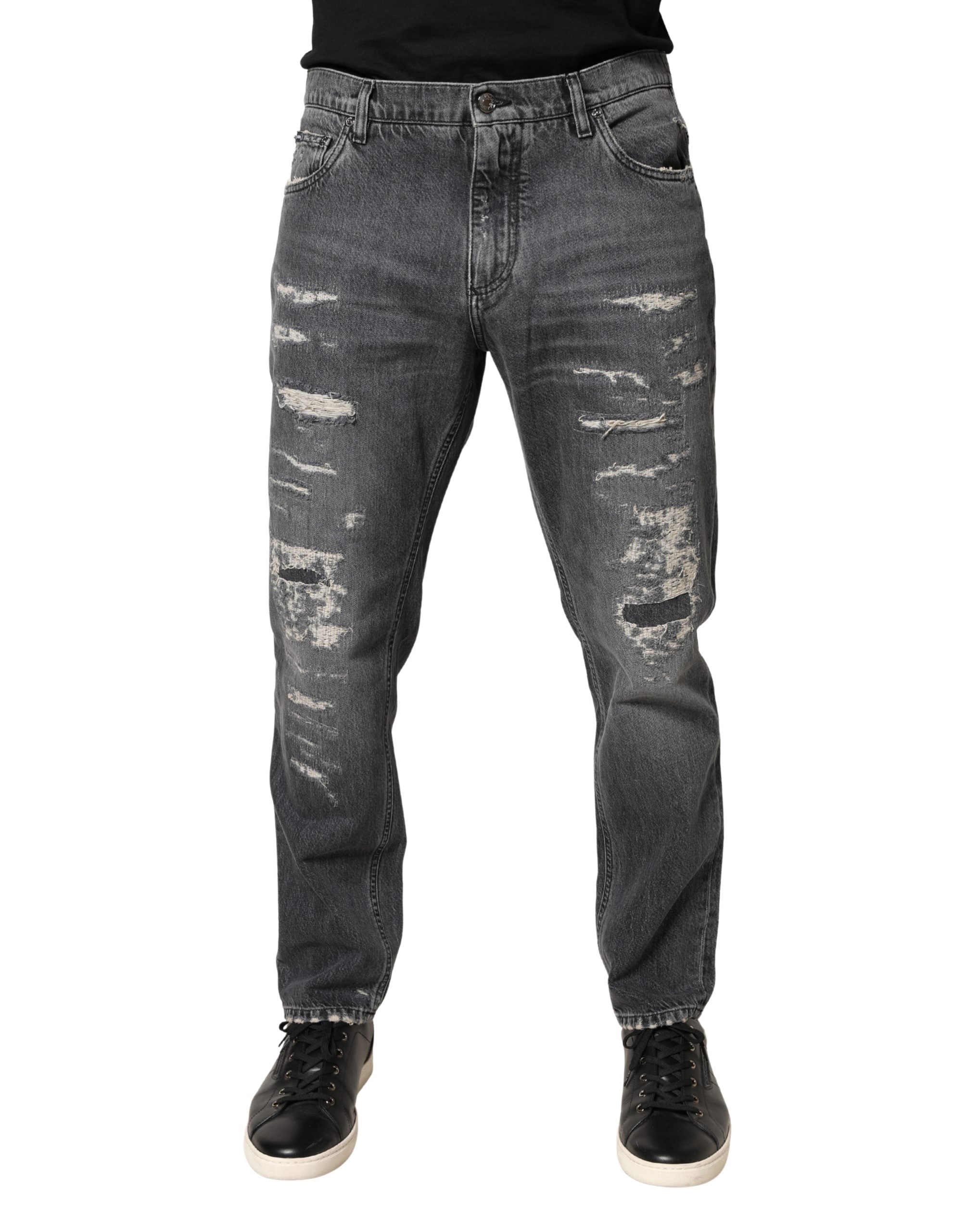 Jeans en denim gris foncé déchiré de coupe ample de Dolce & Gabbana, tissu en coton, style décontracté et tendance.