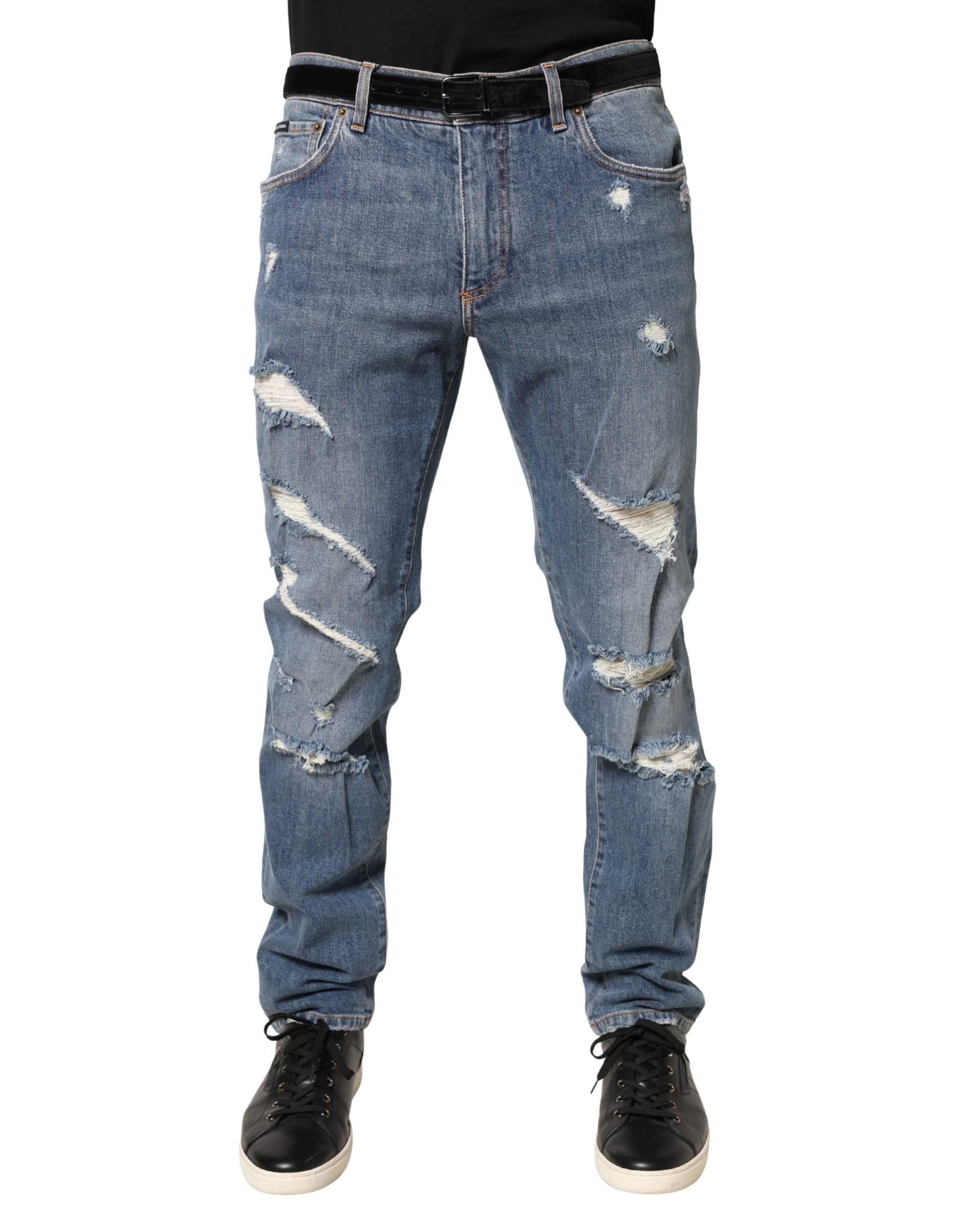 Jeans slim déchirés en coton bleu de Dolce & Gabbana, coupe ajustée et style décontracté avec détails usés.