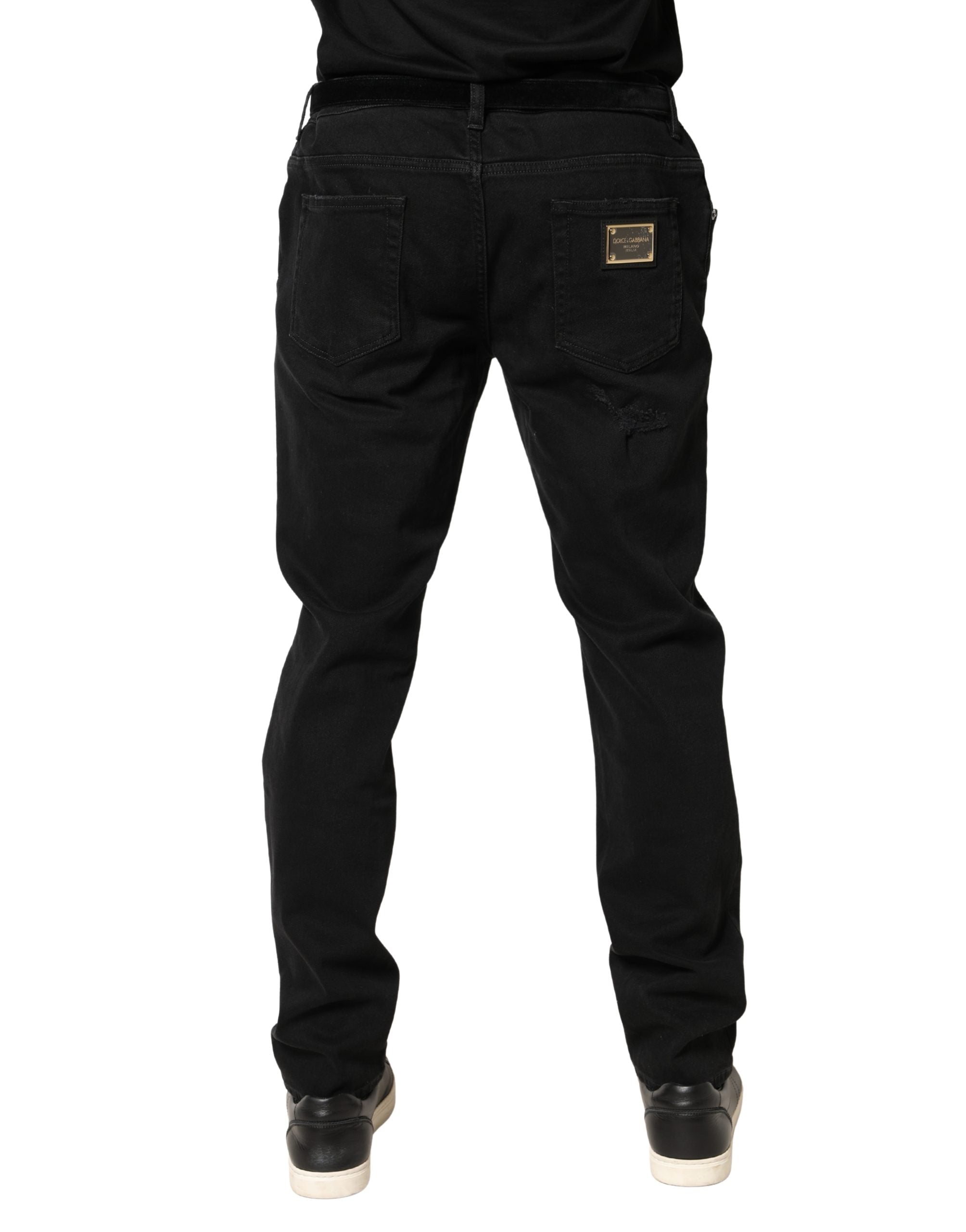 Jeans skinny en denim noir déchiré de Dolce & Gabbana, coupe ajustée en coton, avec détails usés et style tendance.