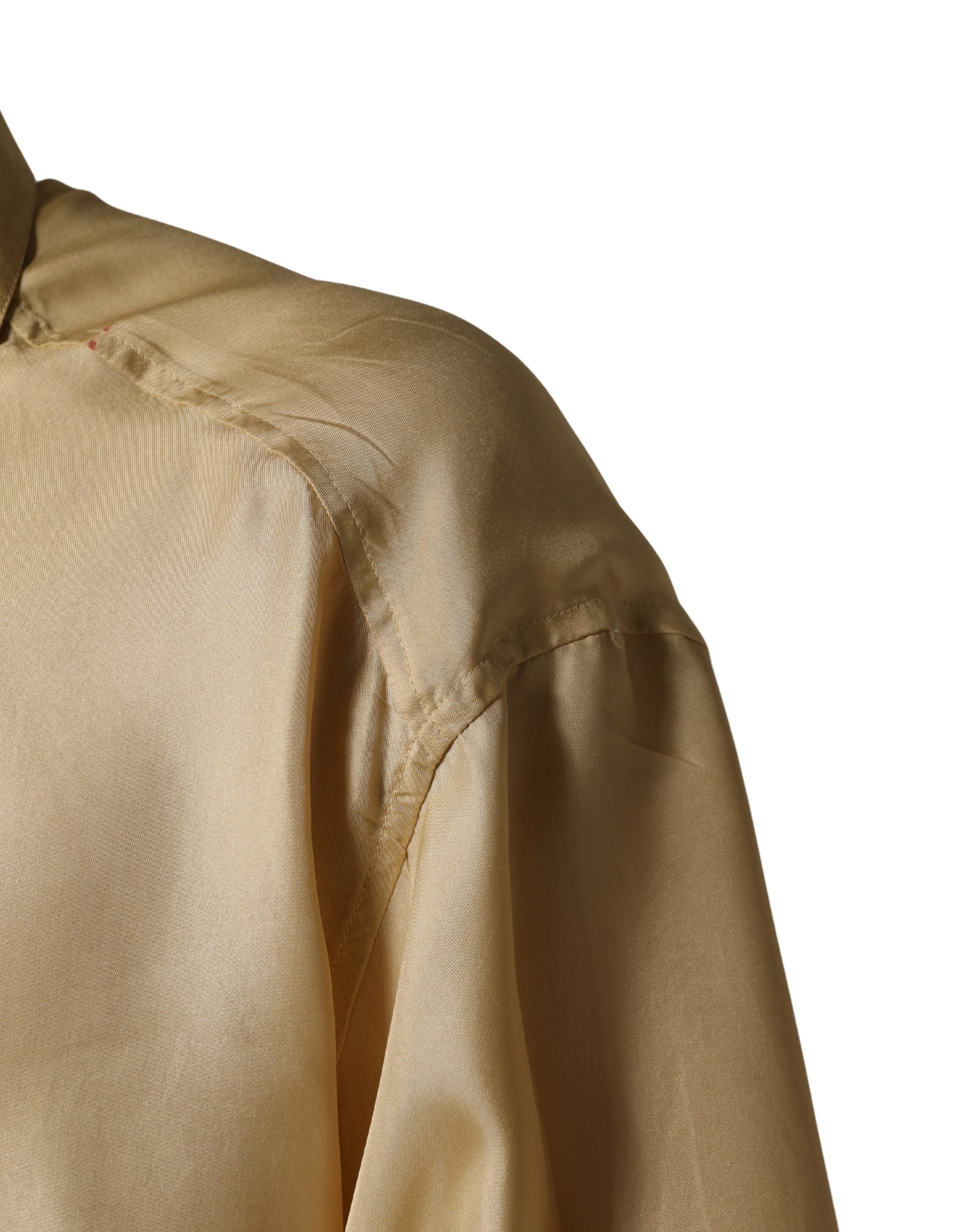 Chemise homme oversize en soie jaune Dolce & Gabbana avec boutons, vue de face sur fond neutre.