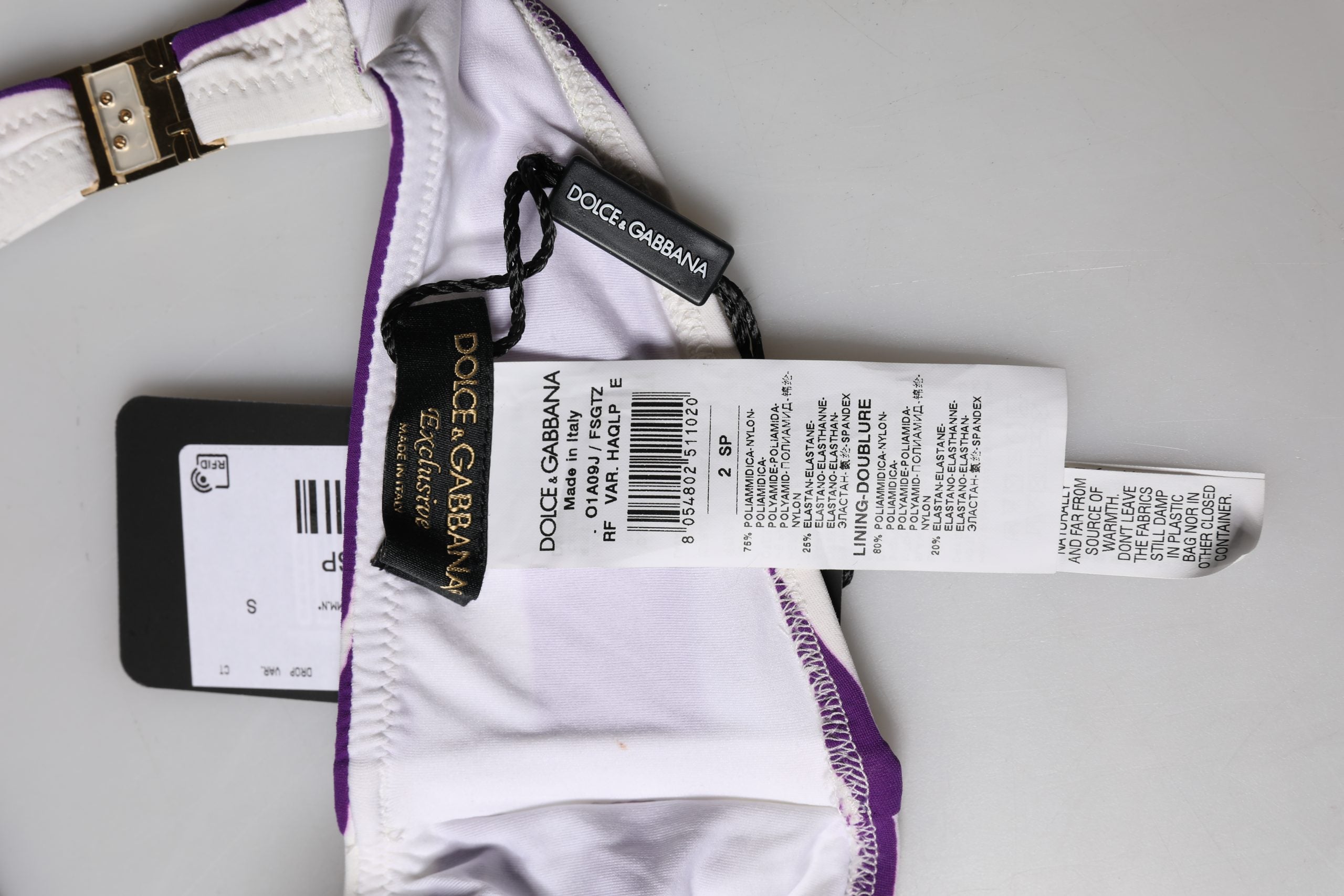 Maillot de bain bandeau en nylon à rayures blanches et violettes de Dolce & Gabbana, style élégant et tendance.