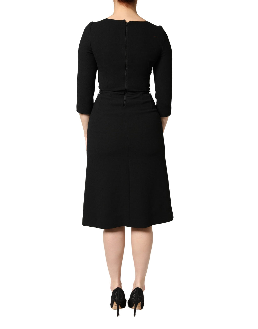 Robe midi noire en laine Dolce & Gabbana avec patch en forme de cœur sacré, détails élégants et style sophistiqué.