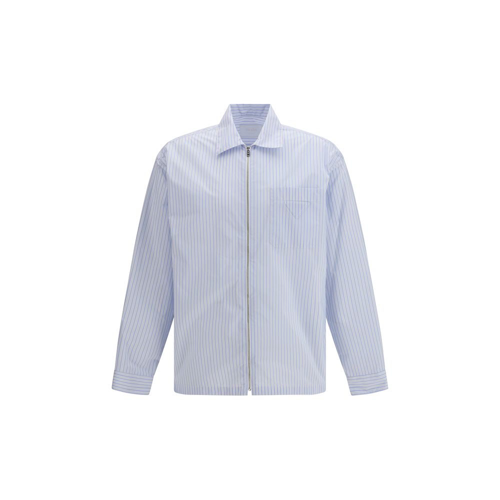 Chemise en nylon bleu à motif de la marque Prada, style élégant et moderne, visible sur le produit.