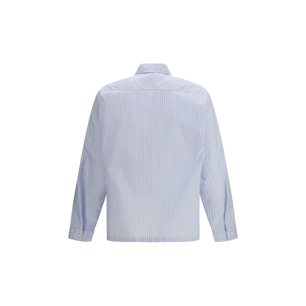 Chemise en polyamide bleue Prada avec motif, vue rapprochée montrant le tissu et le design élégant.