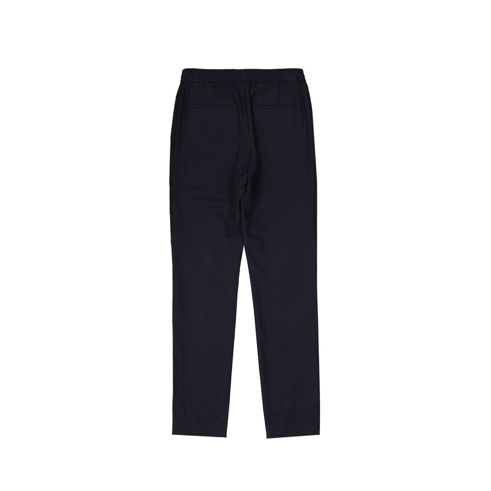 Pantalon casual en laine bleue de la marque Givenchy, coupe décontractée, porté avec un style élégant et moderne.