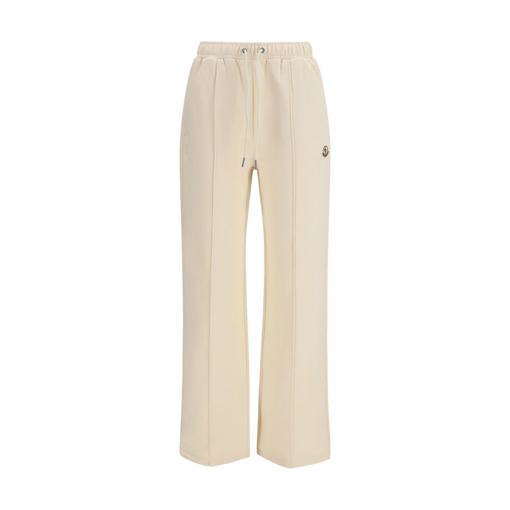 Pantalons de sport en coton beige Moncler pour homme, coupe confortable et style décontracté, visibles dans l'image.