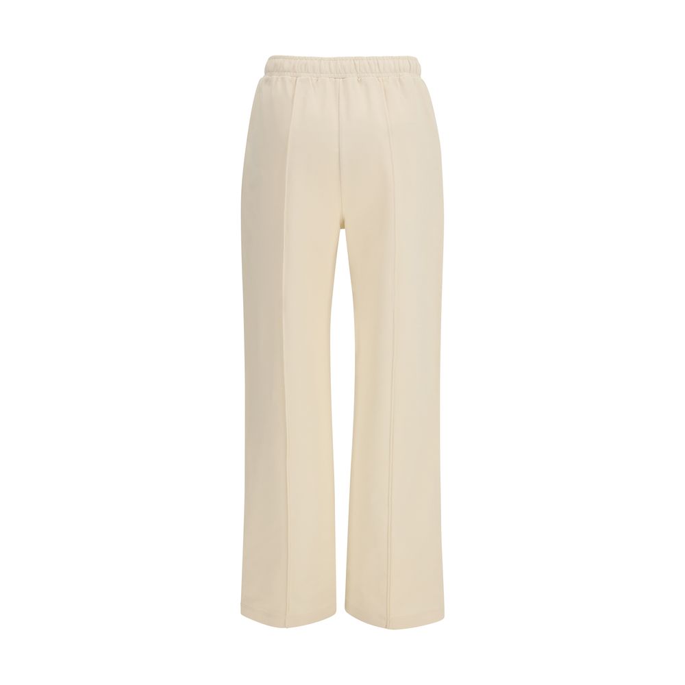 Pantalon de sport beige en coton Moncler, coupe confortable et élégant, adapté pour l'activité physique ou le quotidien.