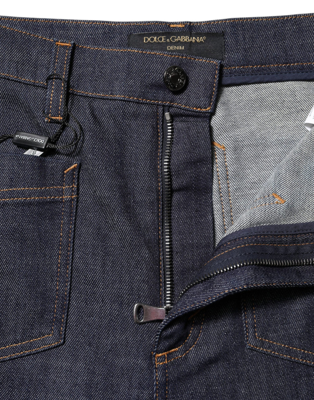 Jean en denim évasé bleu foncé de Dolce & Gabbana, coton, style large et fluide, visible avec poche et détails de couture.